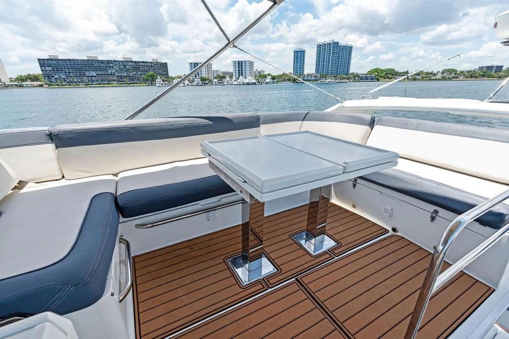 Galeon 500 Fly 2019 yacht with stylish deck and seating area.