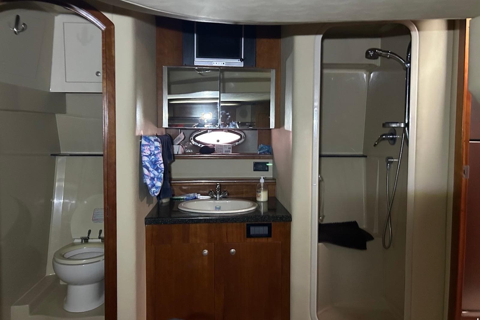 Luxurious bathroom in 2006 Cruisers Yachts 460 Express, featuring shower and vanity.