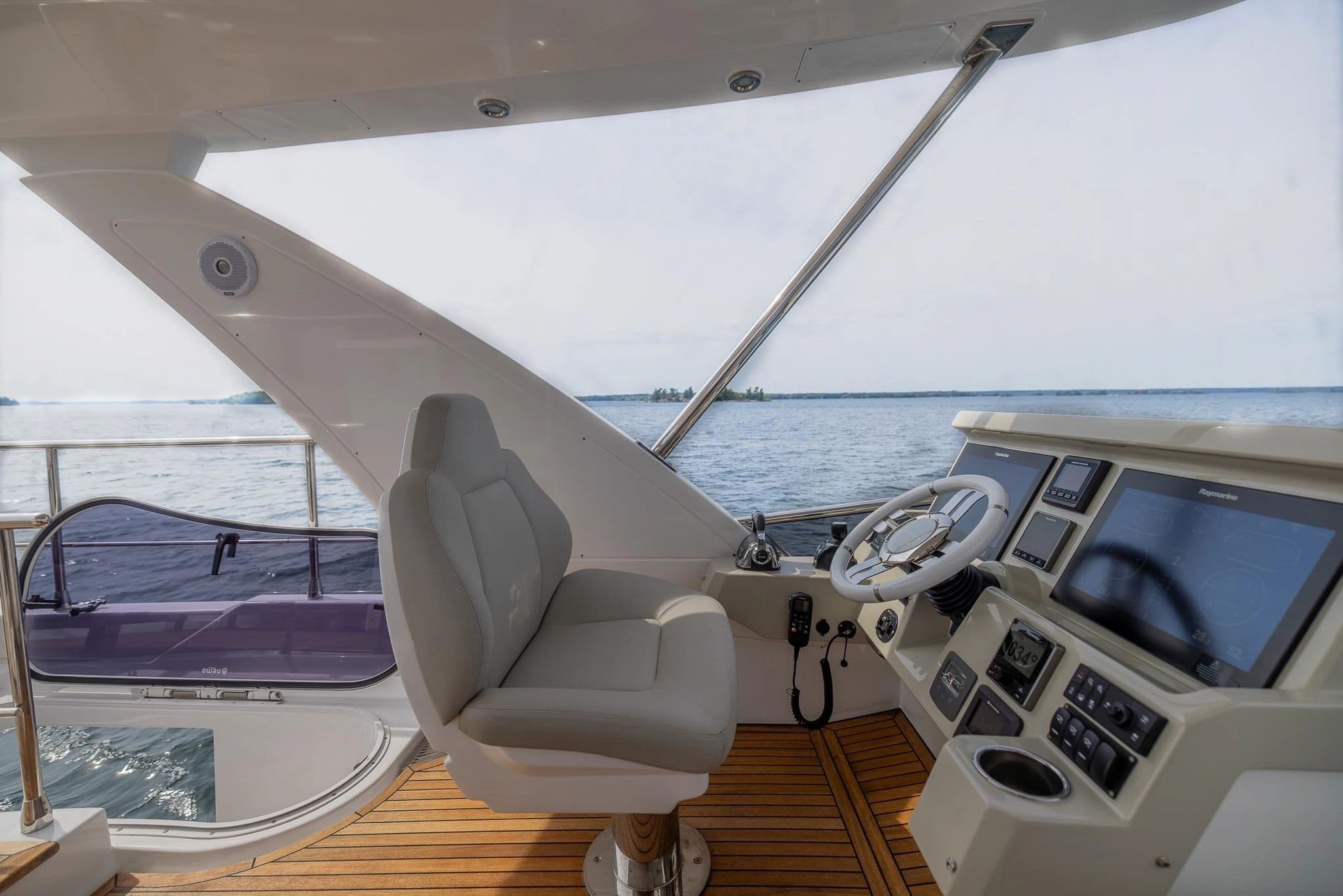 Helm of a 2018 Azimut 50 yacht on open water.