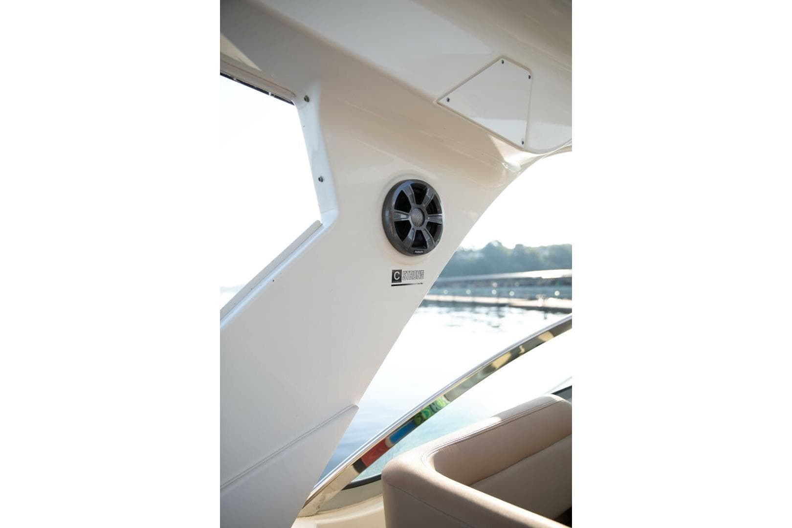 2016 Sea Ray 350 Sundancer interior with speaker and window view.