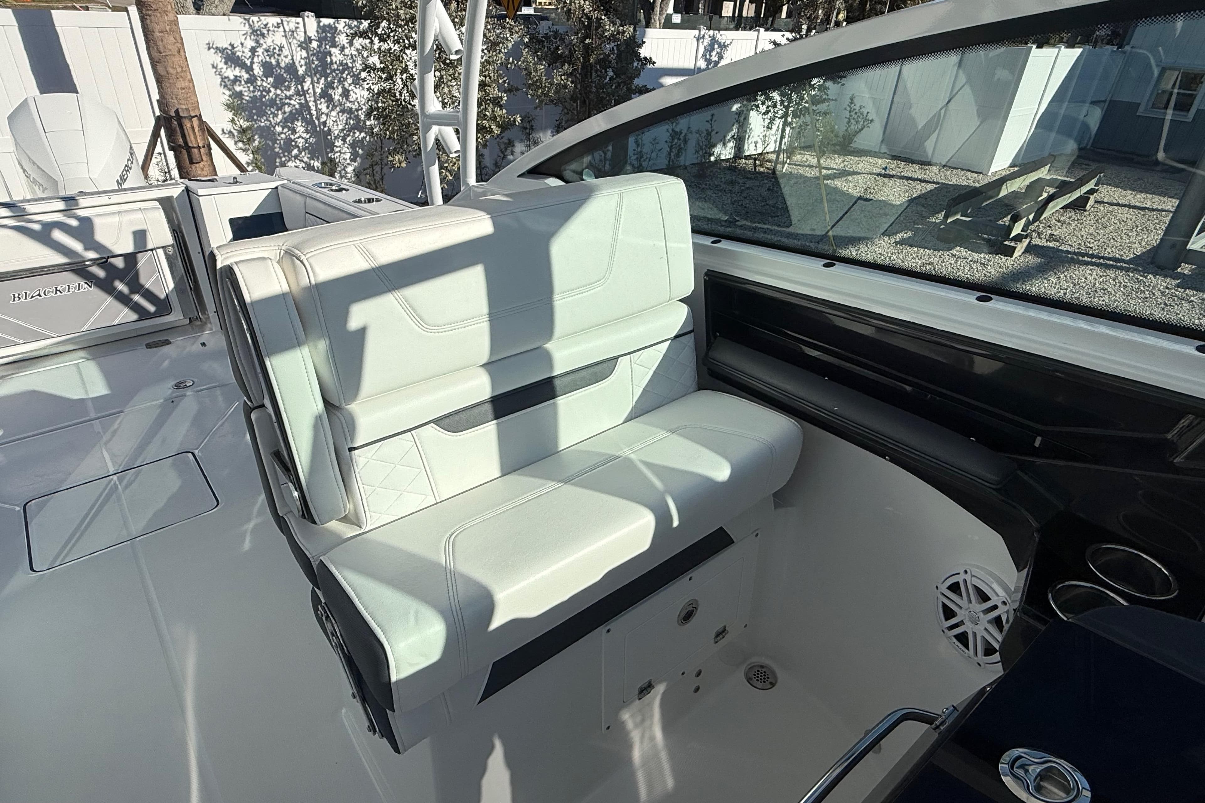 2022 Blackfin 272 DC boat interior with white seating and modern design.