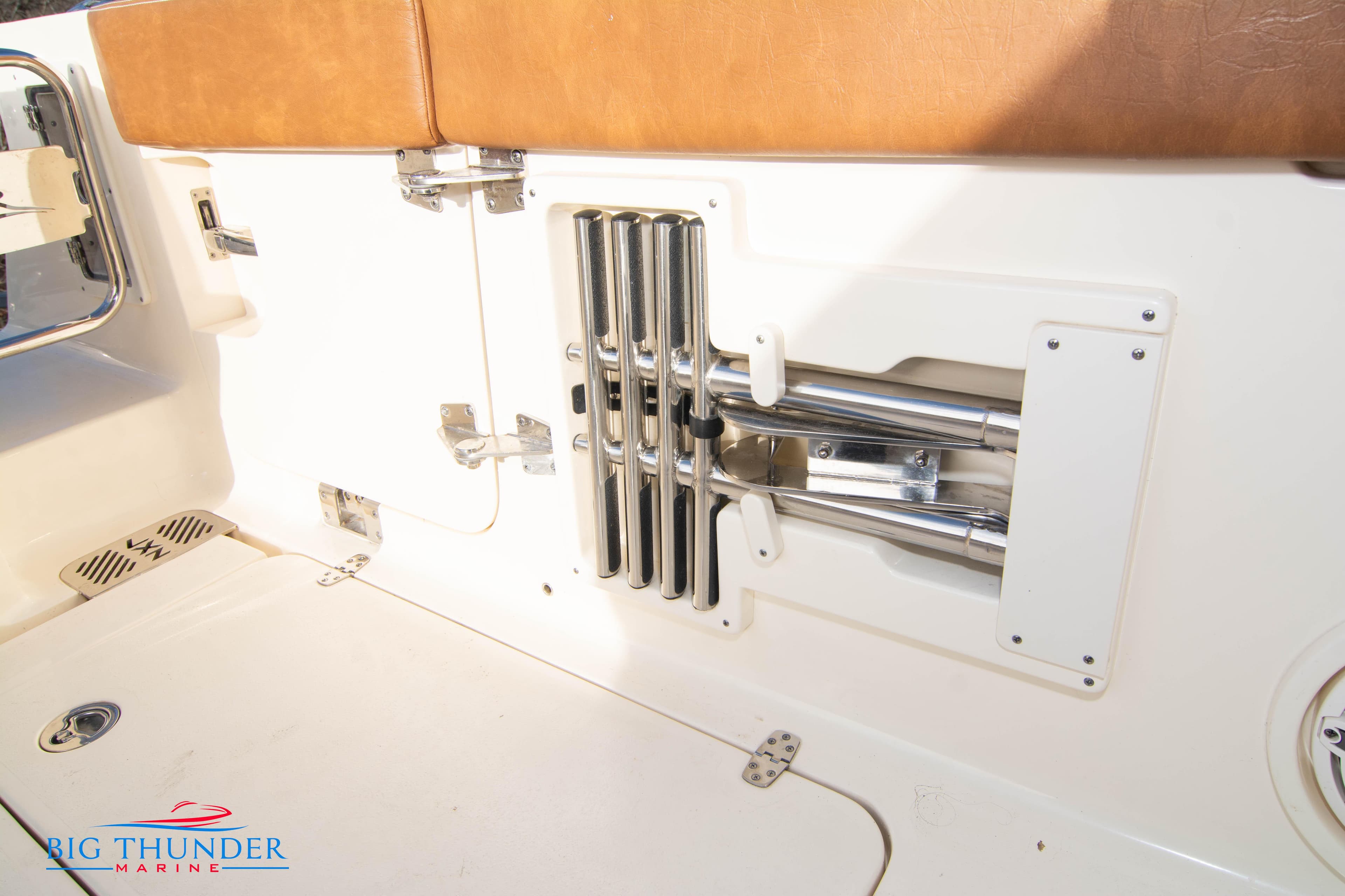 2022 Scout 350 LXZ boat interior with stainless steel rod holders and tan seating.