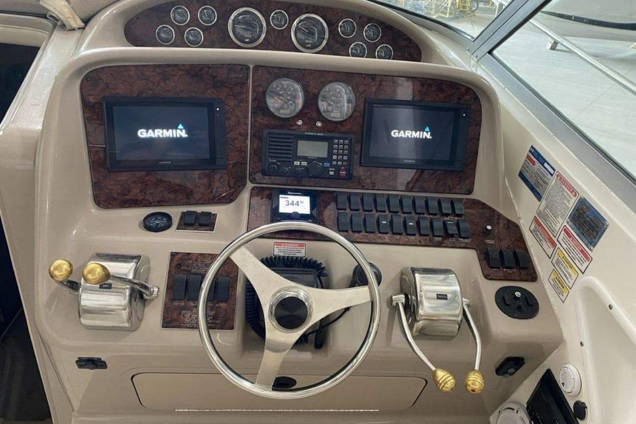 Helm of 2000 Sea Ray 340 Amberjack with Garmin displays and controls.