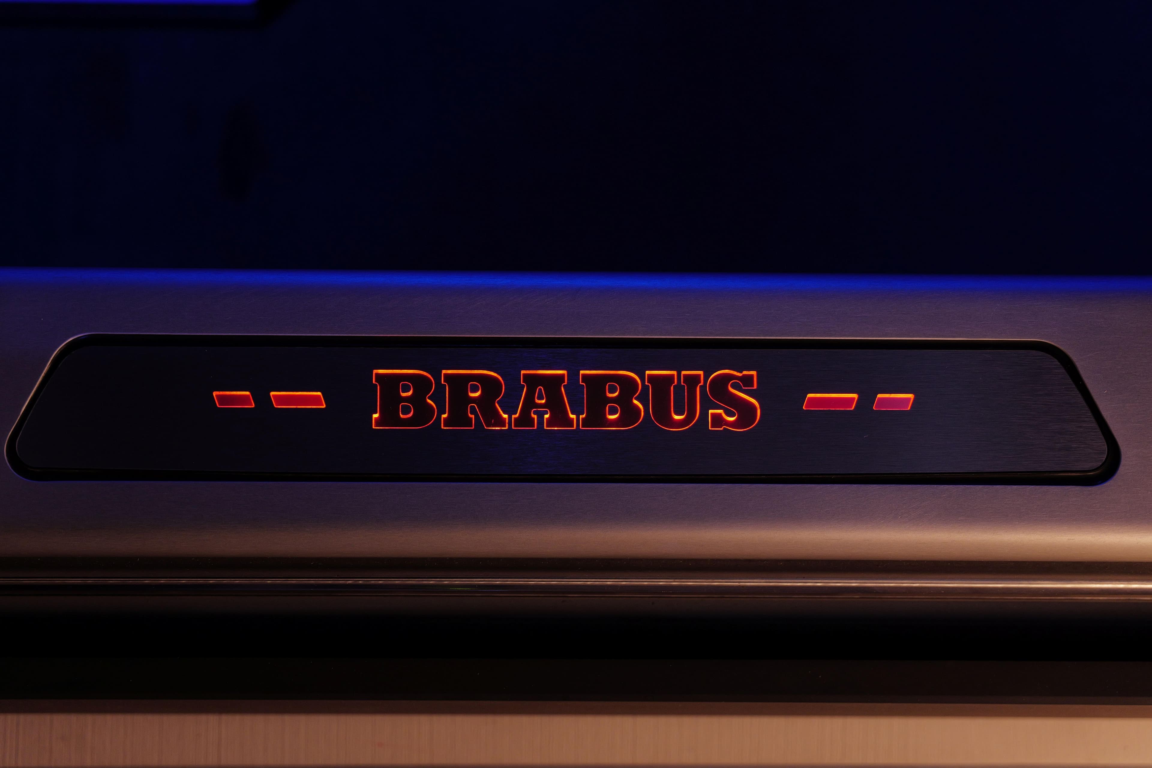 Illuminated BRABUS logo on 2026 BRABUS 1500 vehicle interior.