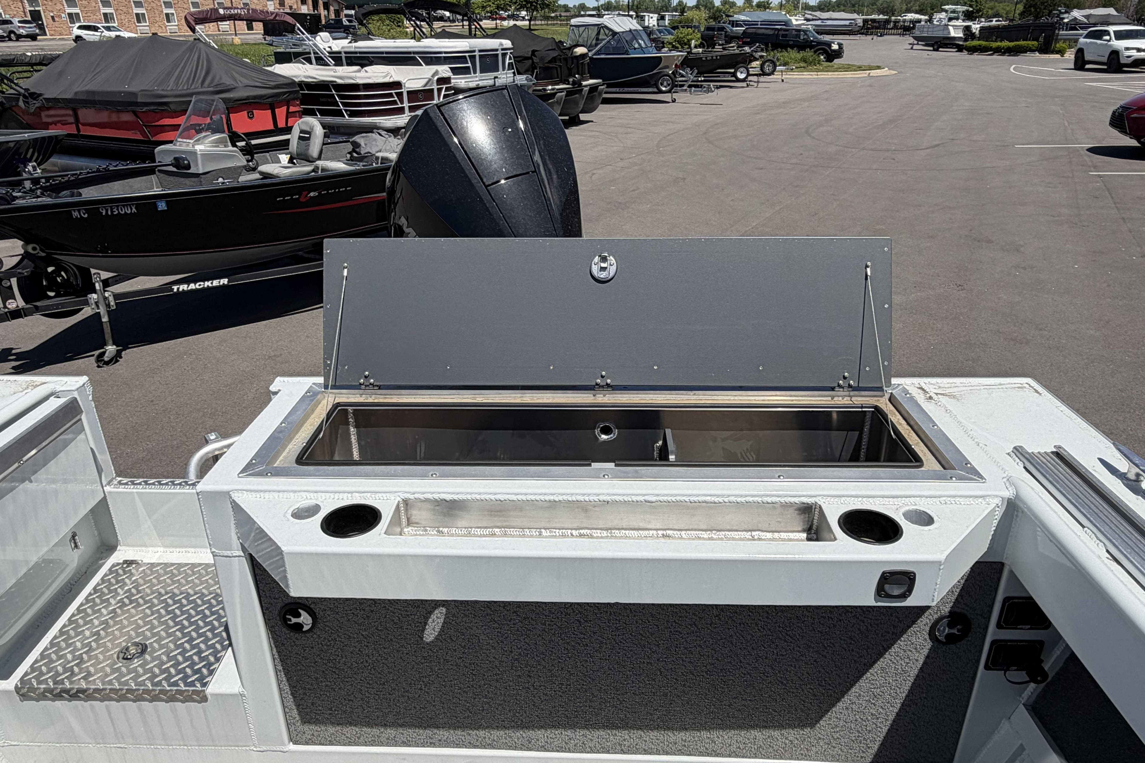 2026 Hewescraft 240 Ocean Pro ET Hardtop boat with open storage compartment.