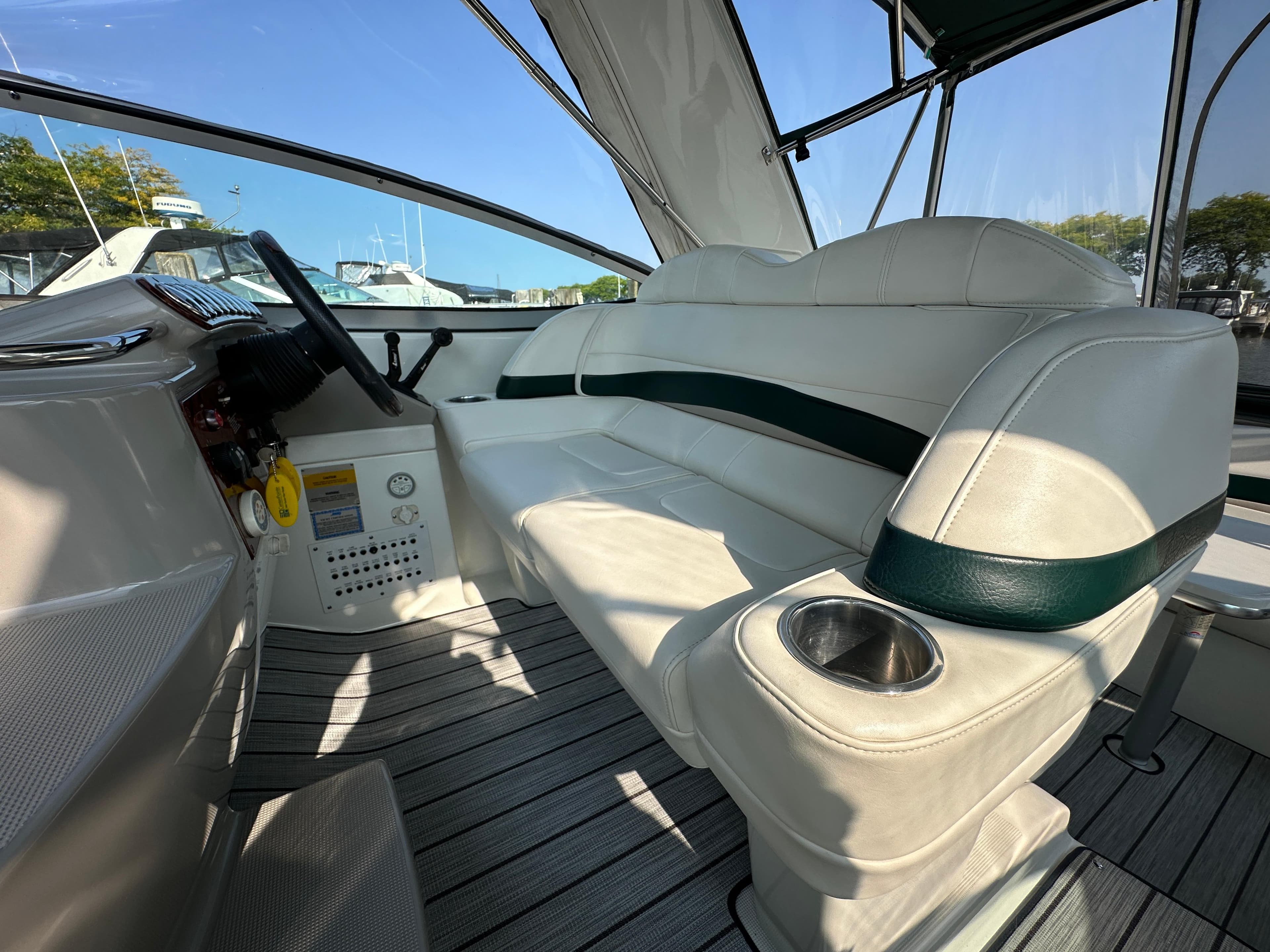 2004 Formula 34 PC boat interior with white seating and cup holder.