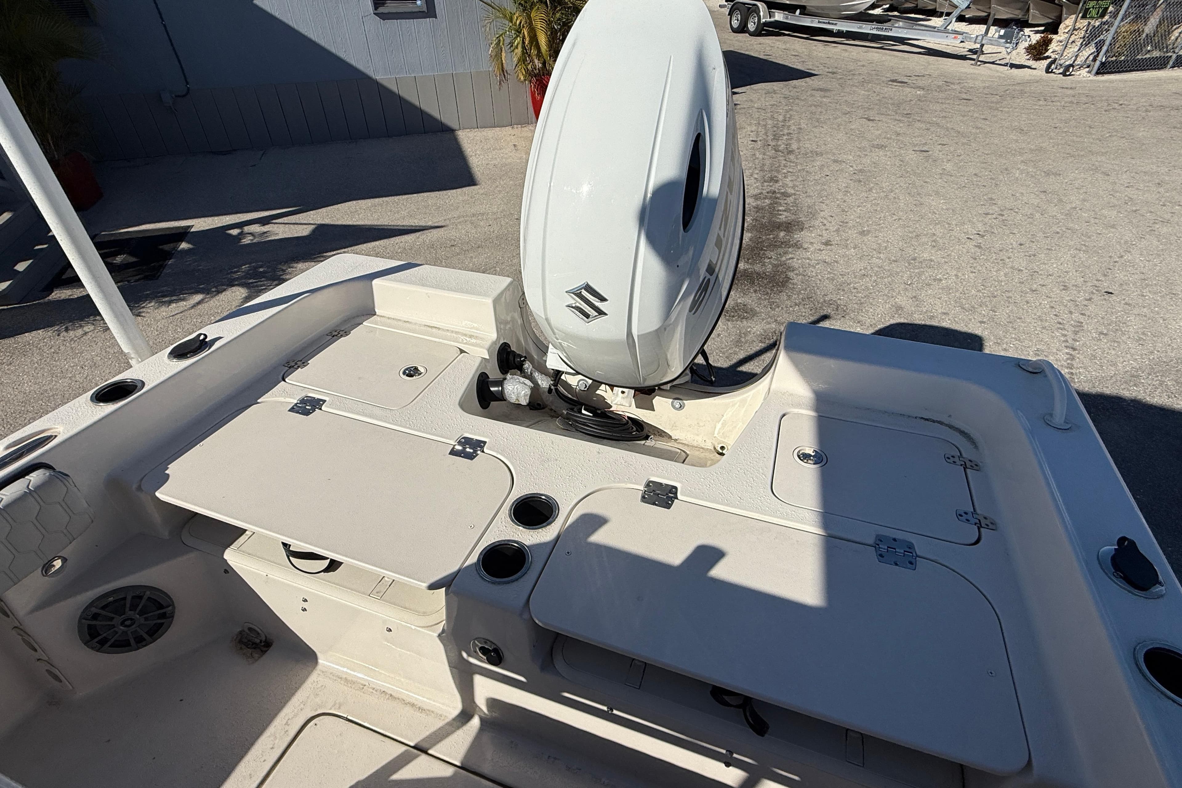 2025 Carolina Skiff 21 Ultra Elite boat interior with motor and storage compartments.