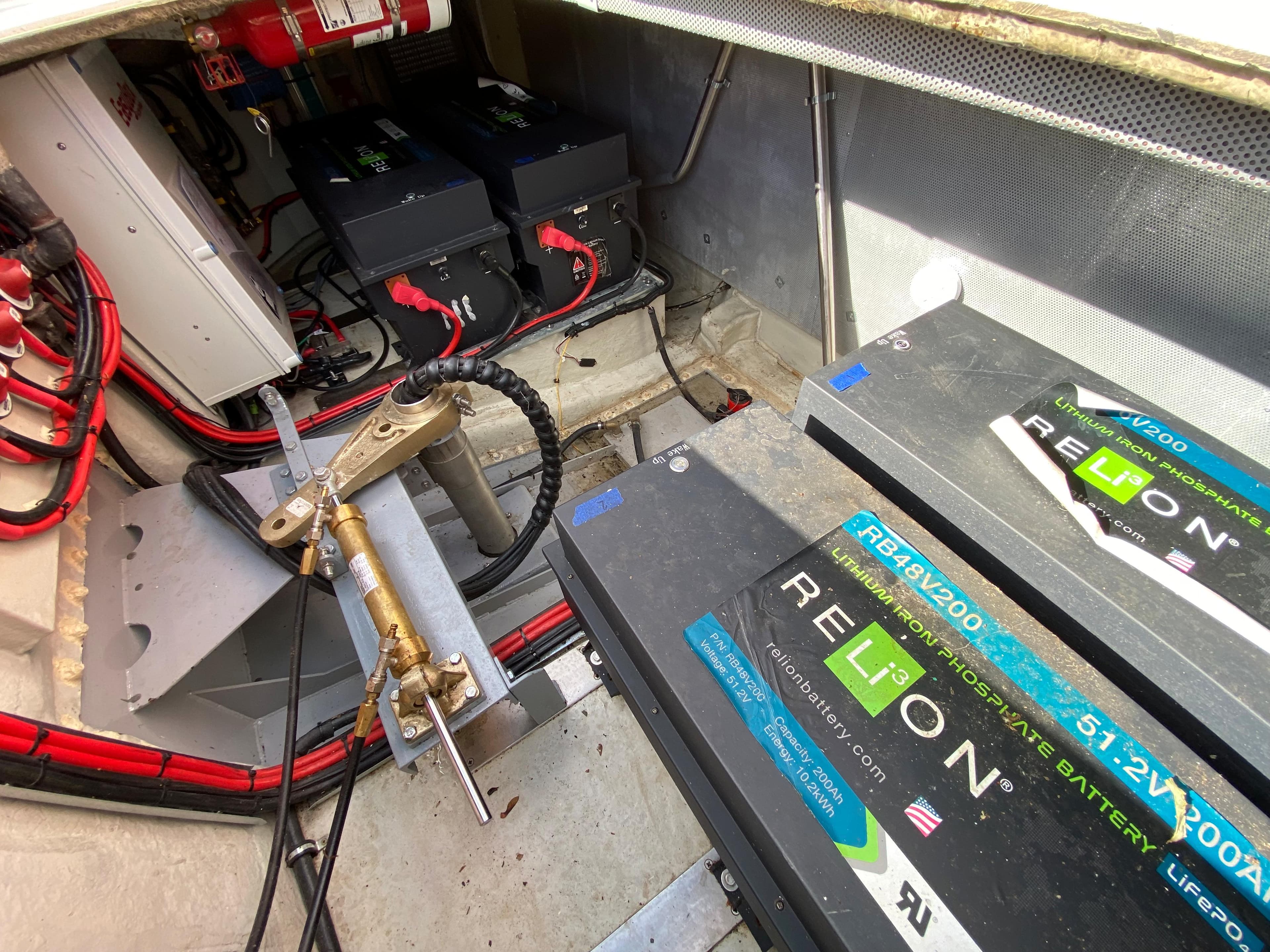 Battery compartment of a 1990 Bounty 60 River Bus with Relion lithium batteries.