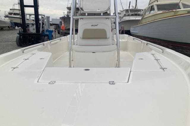 2023 Bulls Bay 2400 boat, white deck, marina background, multiple boats visible.