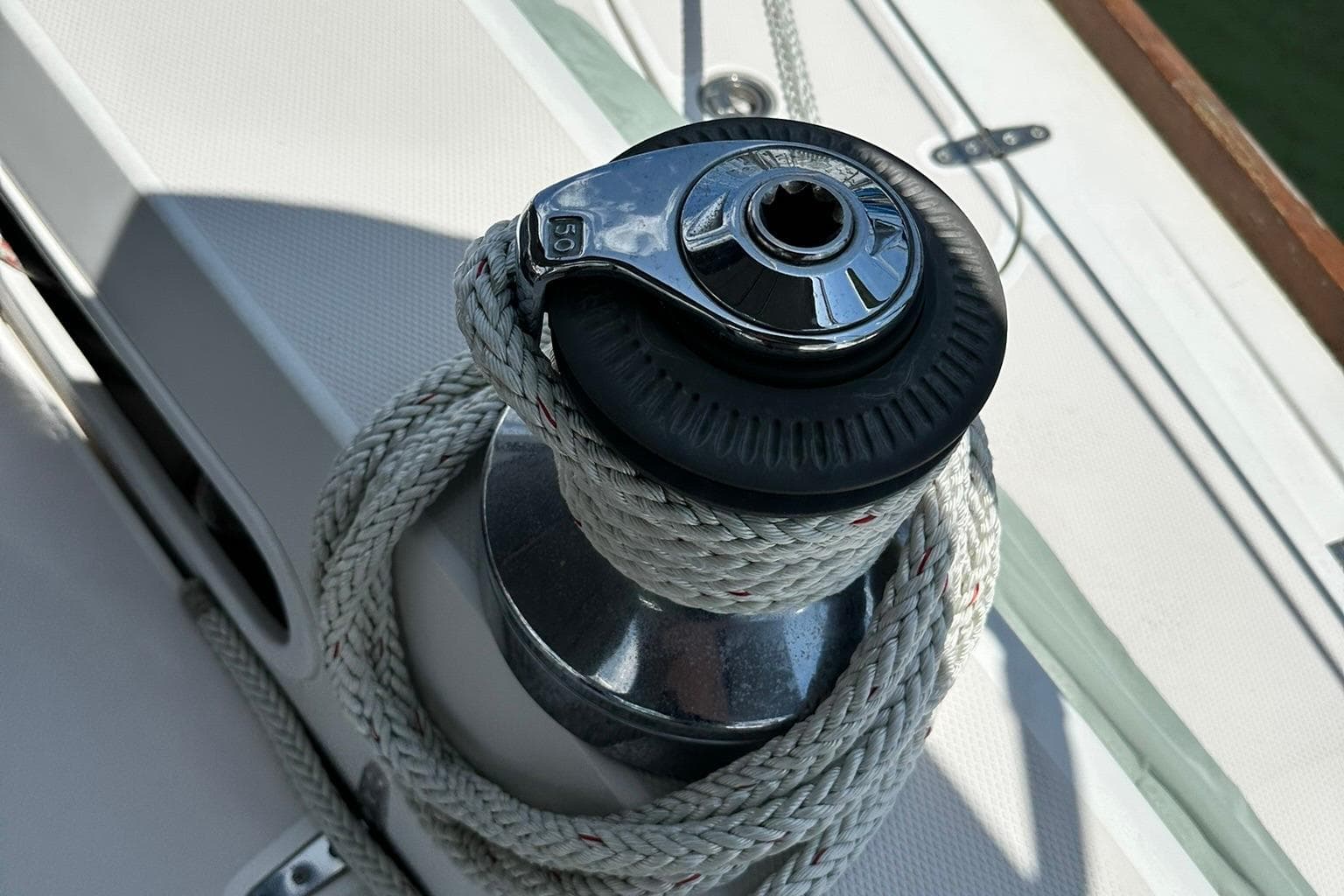 Winch with rope on 2007 Sabre 386 sailboat deck.