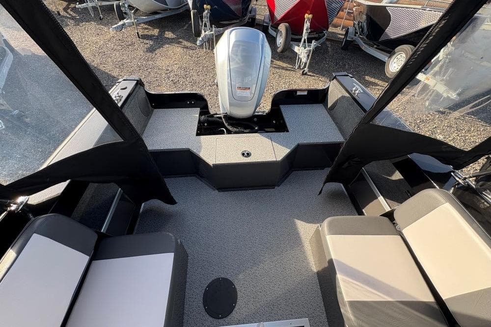 2026 Smoker Craft Osprey 162 boat interior with seating and motor, showcasing modern design.