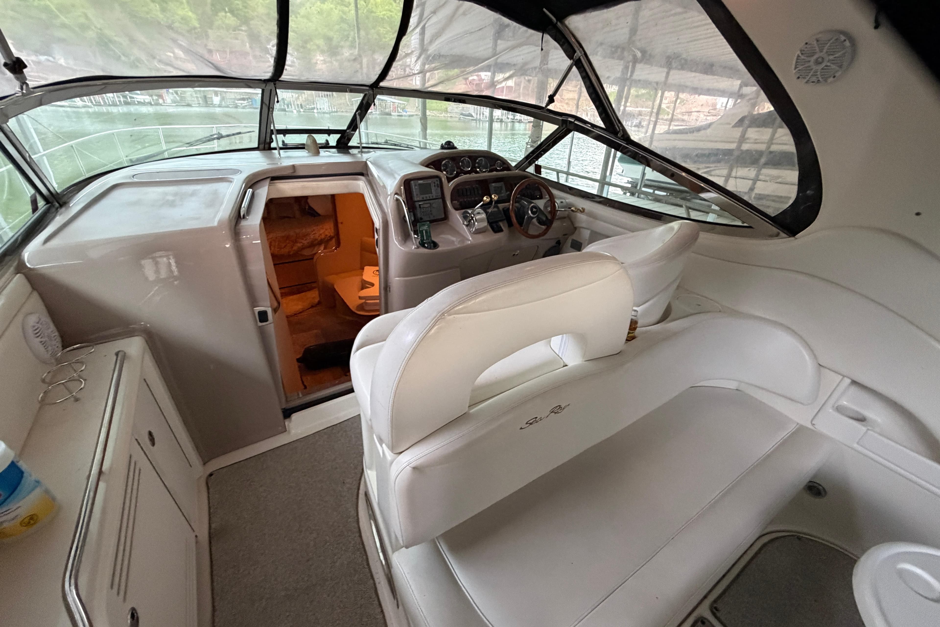 Interior view of 2002 Sea Ray 360 Sundancer yacht cockpit and cabin entrance.