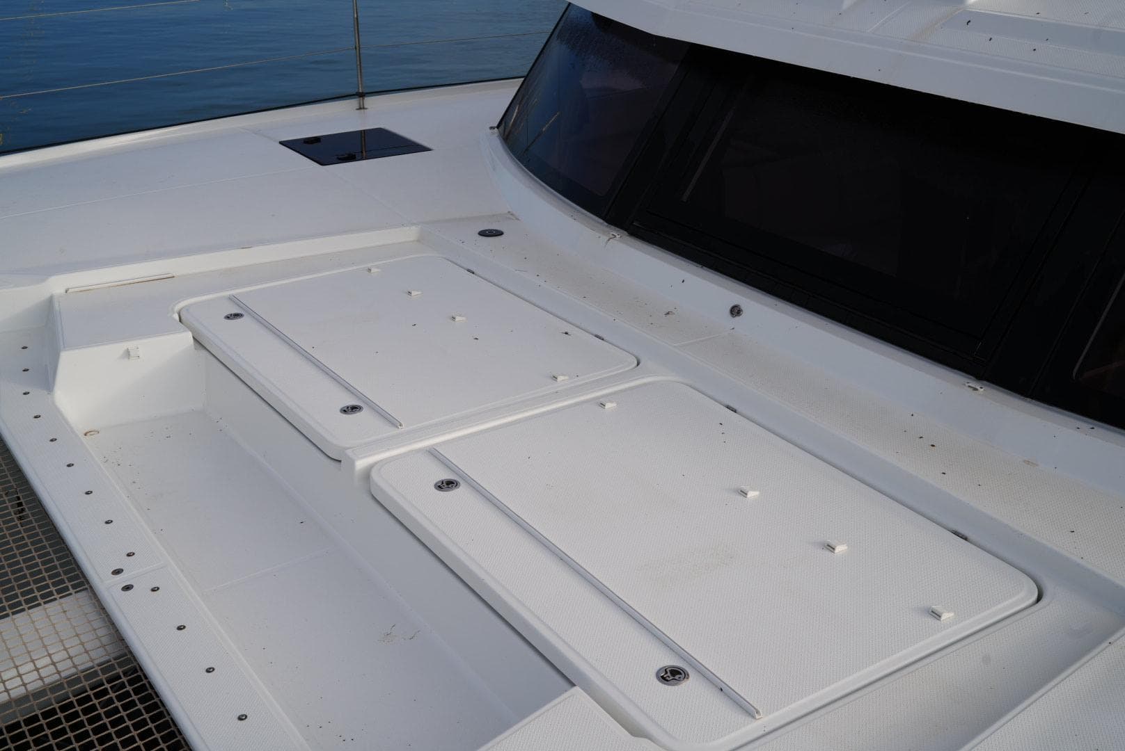 2022 Fountaine Pajot Elba Quatour catamaran deck with storage compartments.
