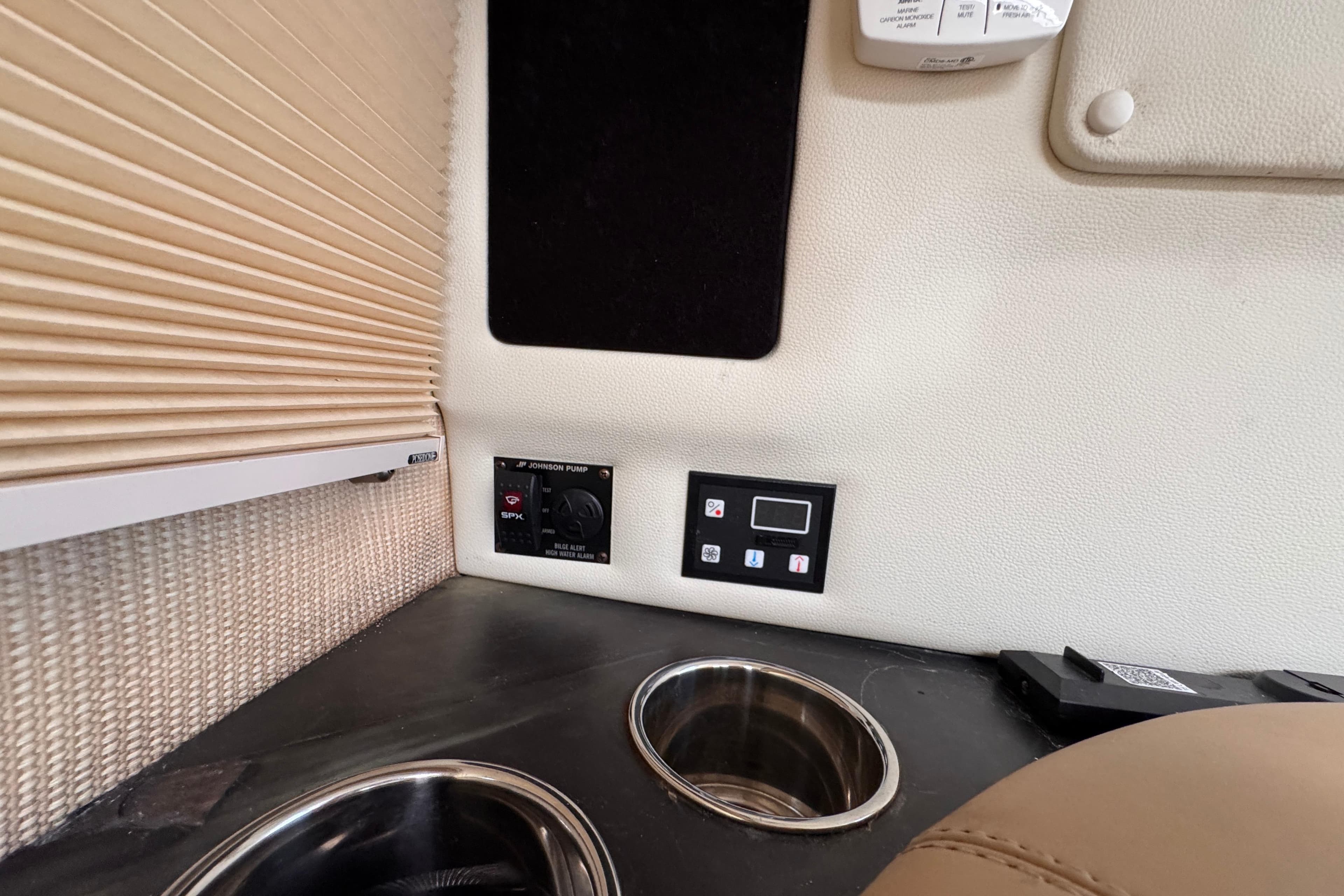 Interior of 2018 Cobalt R35 featuring control panels and cup holders.