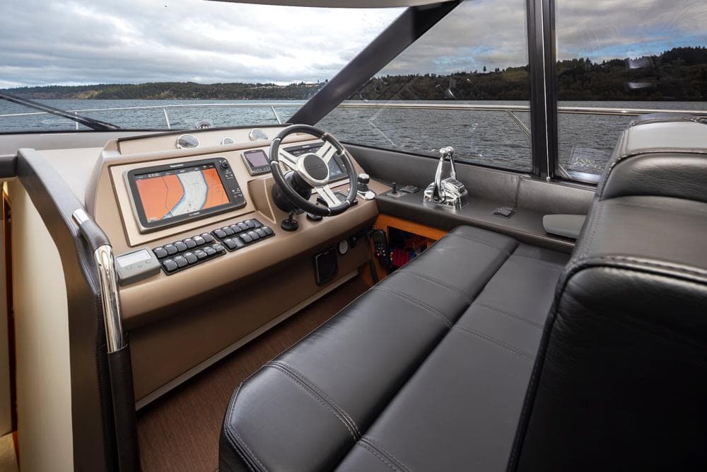 Luxurious interior of a 2017 Prestige 560 yacht with modern navigation system.