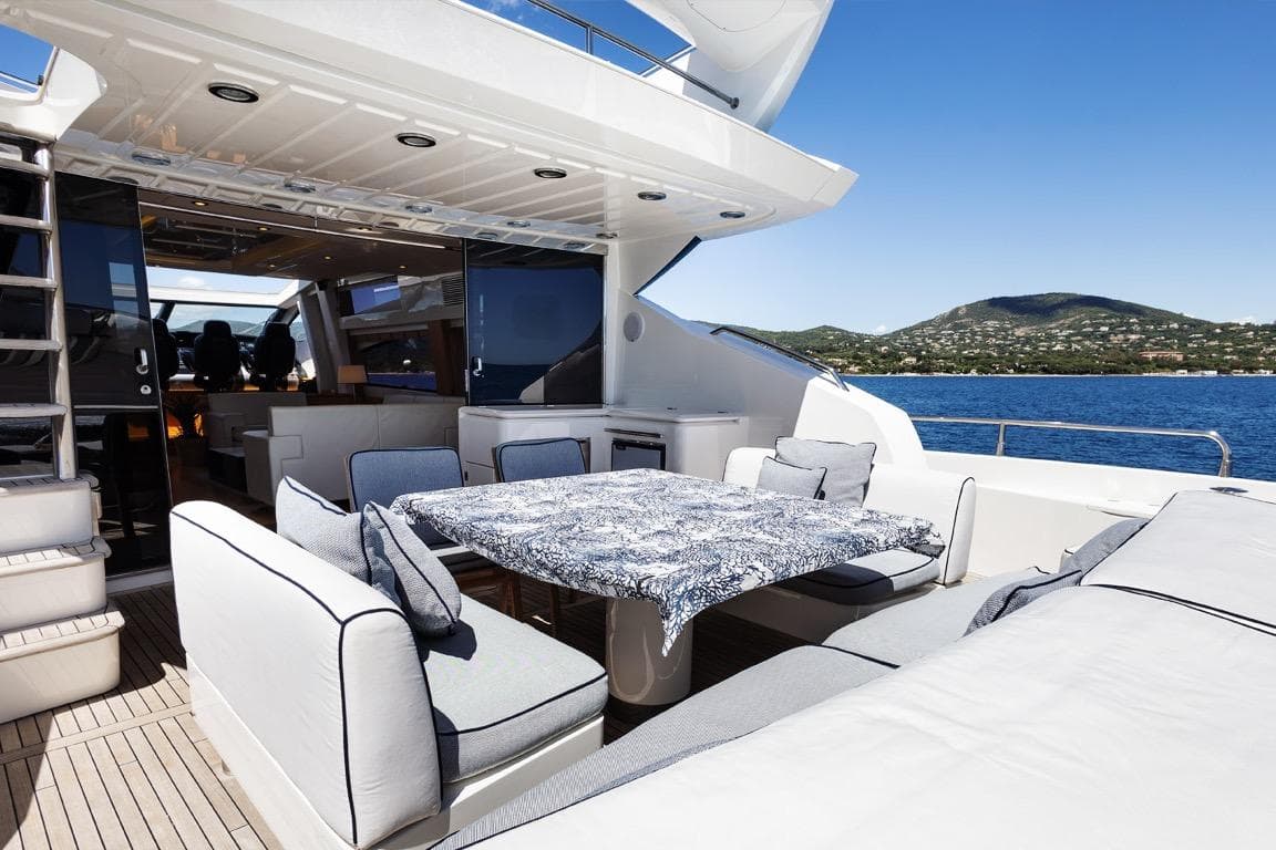Luxurious 2011 Sunseeker Predator 84 yacht deck with elegant seating and ocean view.