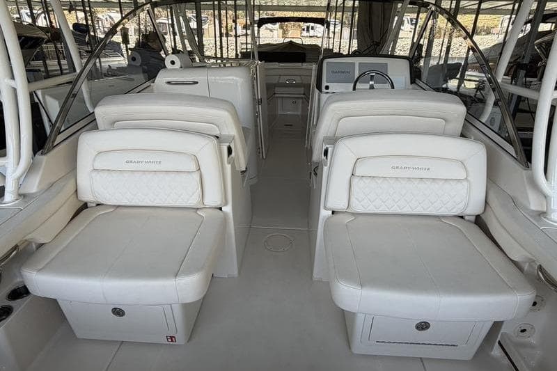2026 Grady-White Freedom 285 boat interior with luxurious white seating and helm.