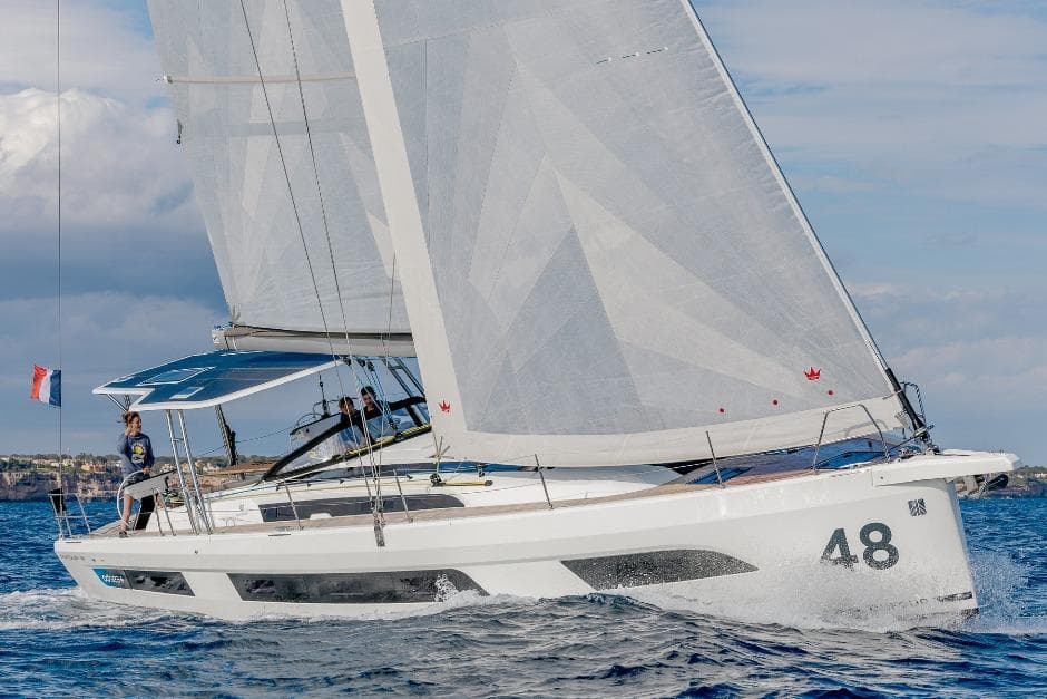 2026 Dufour 48 sailing yacht on open water, showcasing sleek design and performance.