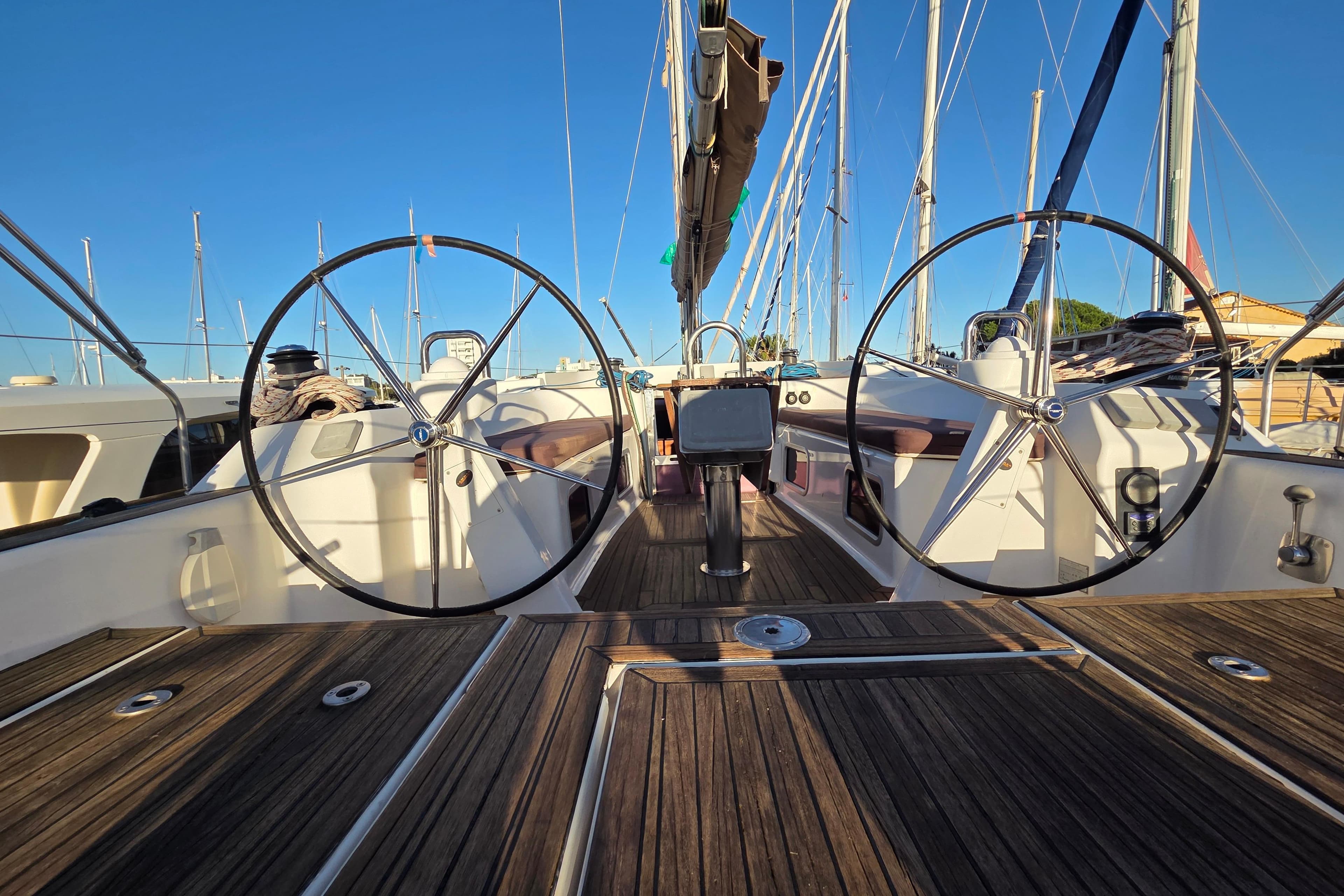 2009 Dufour 485 Grand Large yacht deck with dual steering wheels.