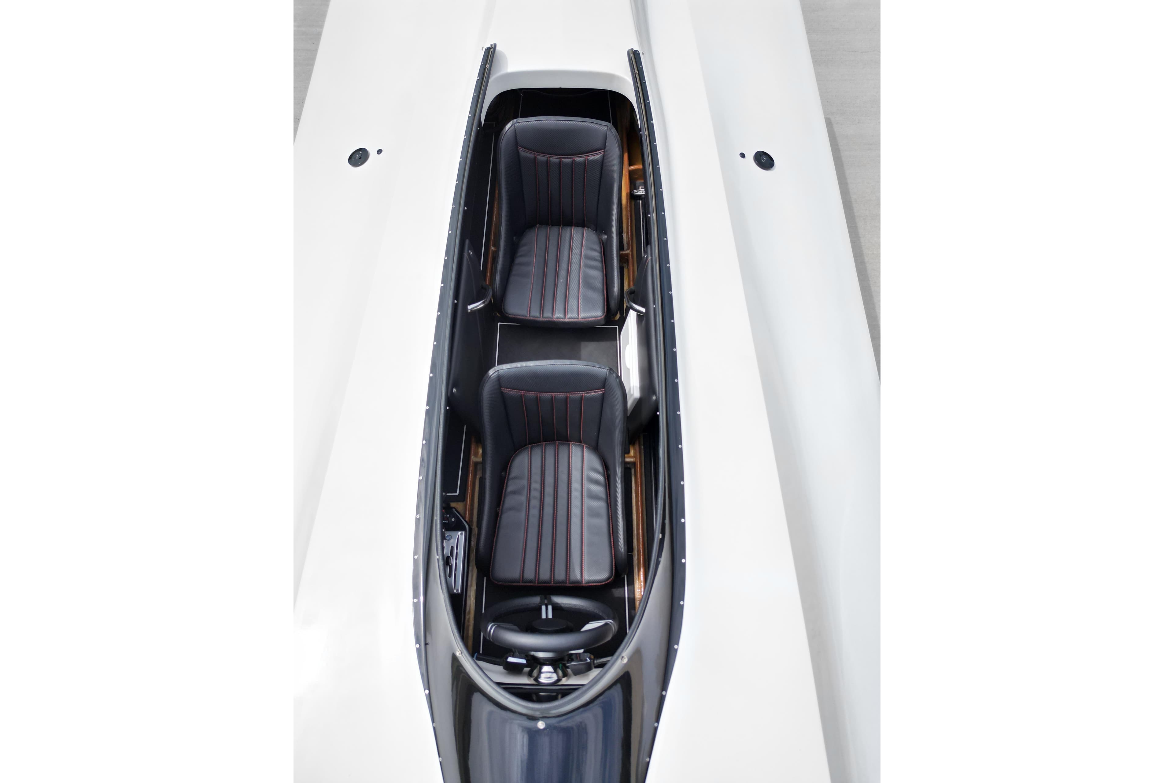 Top view of 2016 Argo 23 boat interior with two black seats.