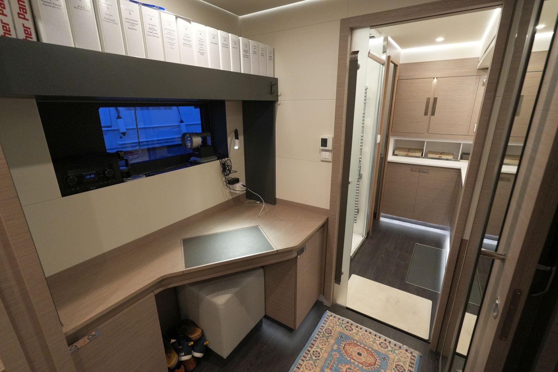 Interior of 2022 Fountaine Pajot Alegria 67 yacht with modern design and workspace.