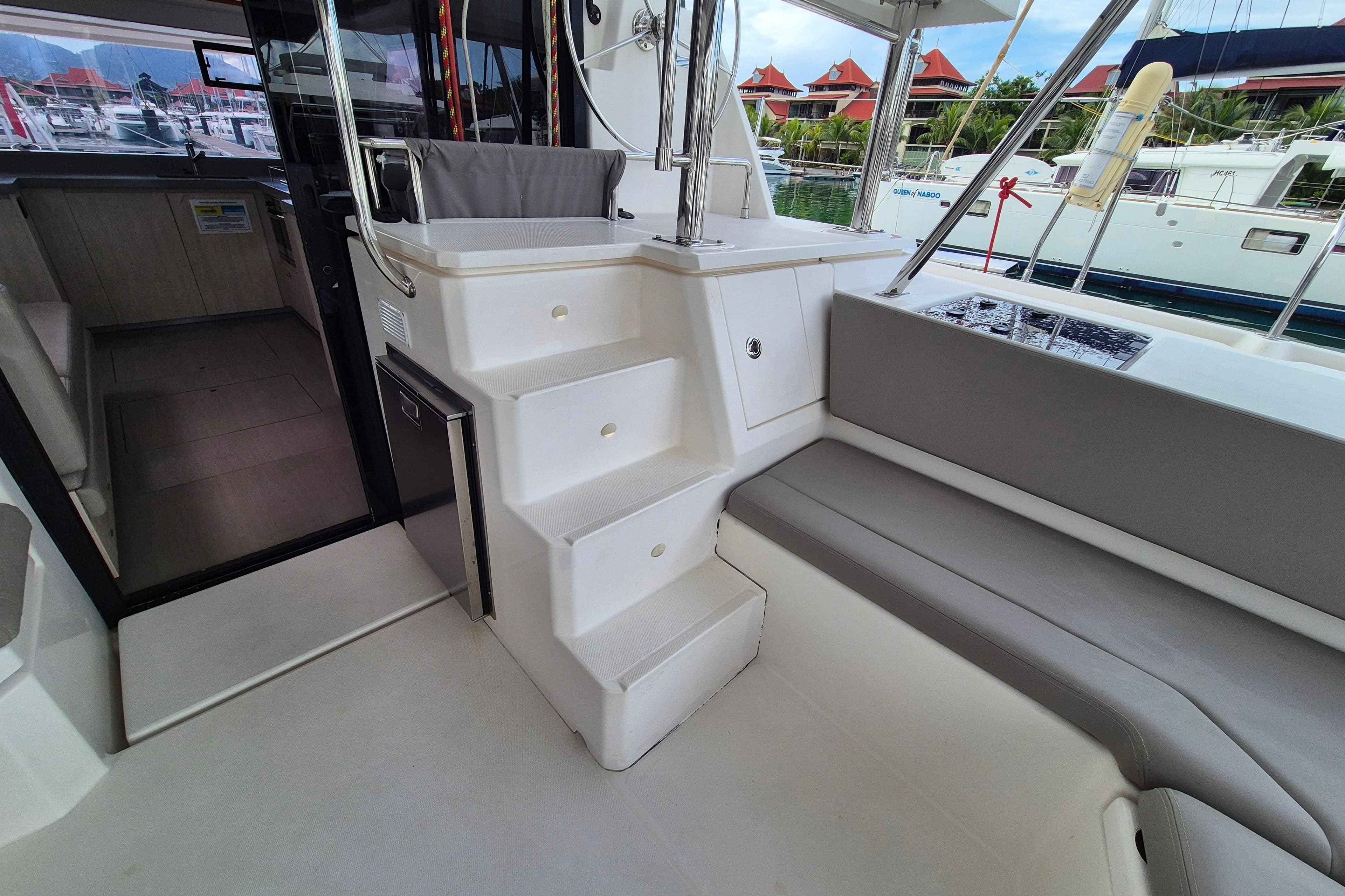 Leopard 45 yacht interior with stairs, seating, and marina view, 2020 model.