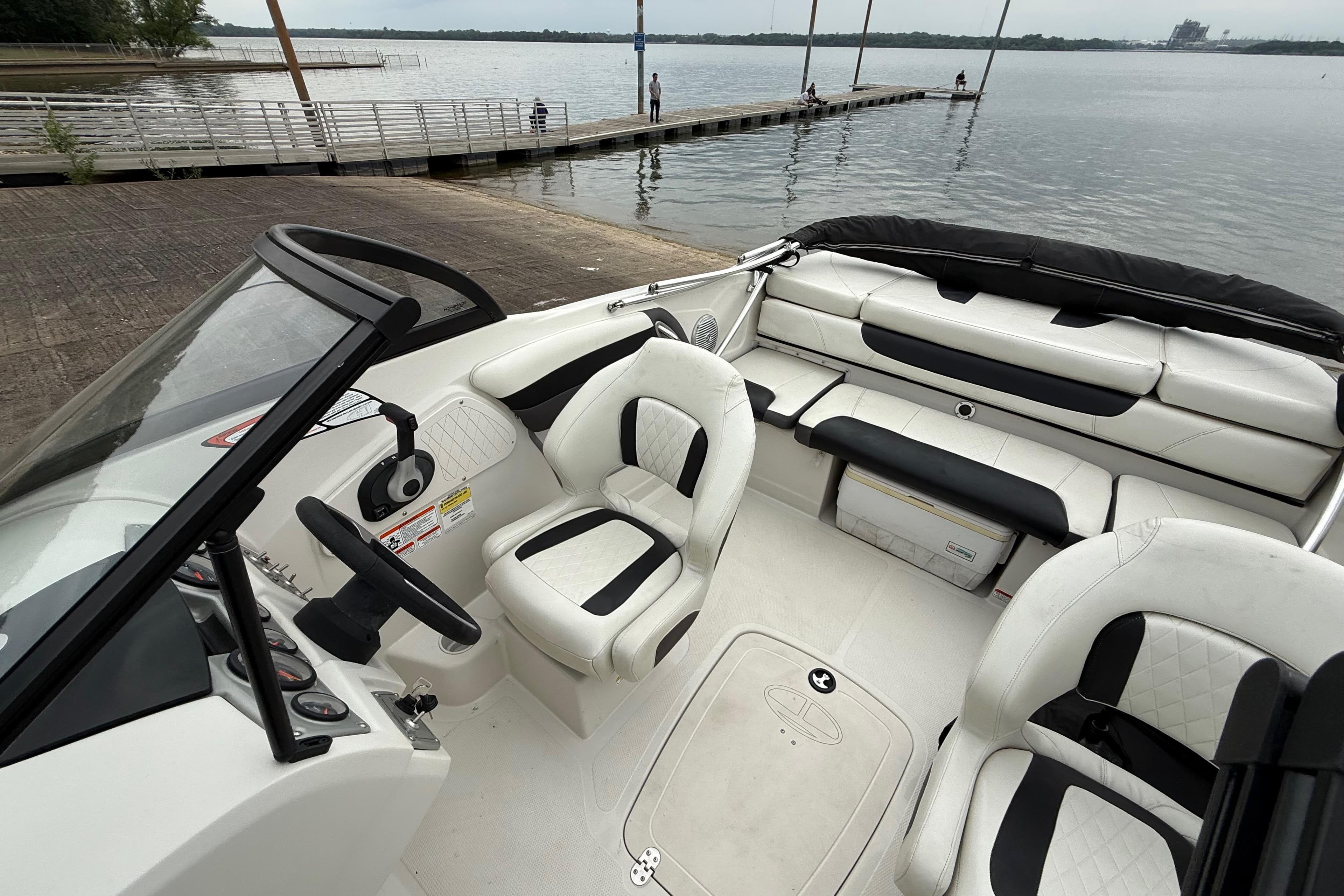 2016 Tahoe 500 TF boat interior with white seating, dockside view.