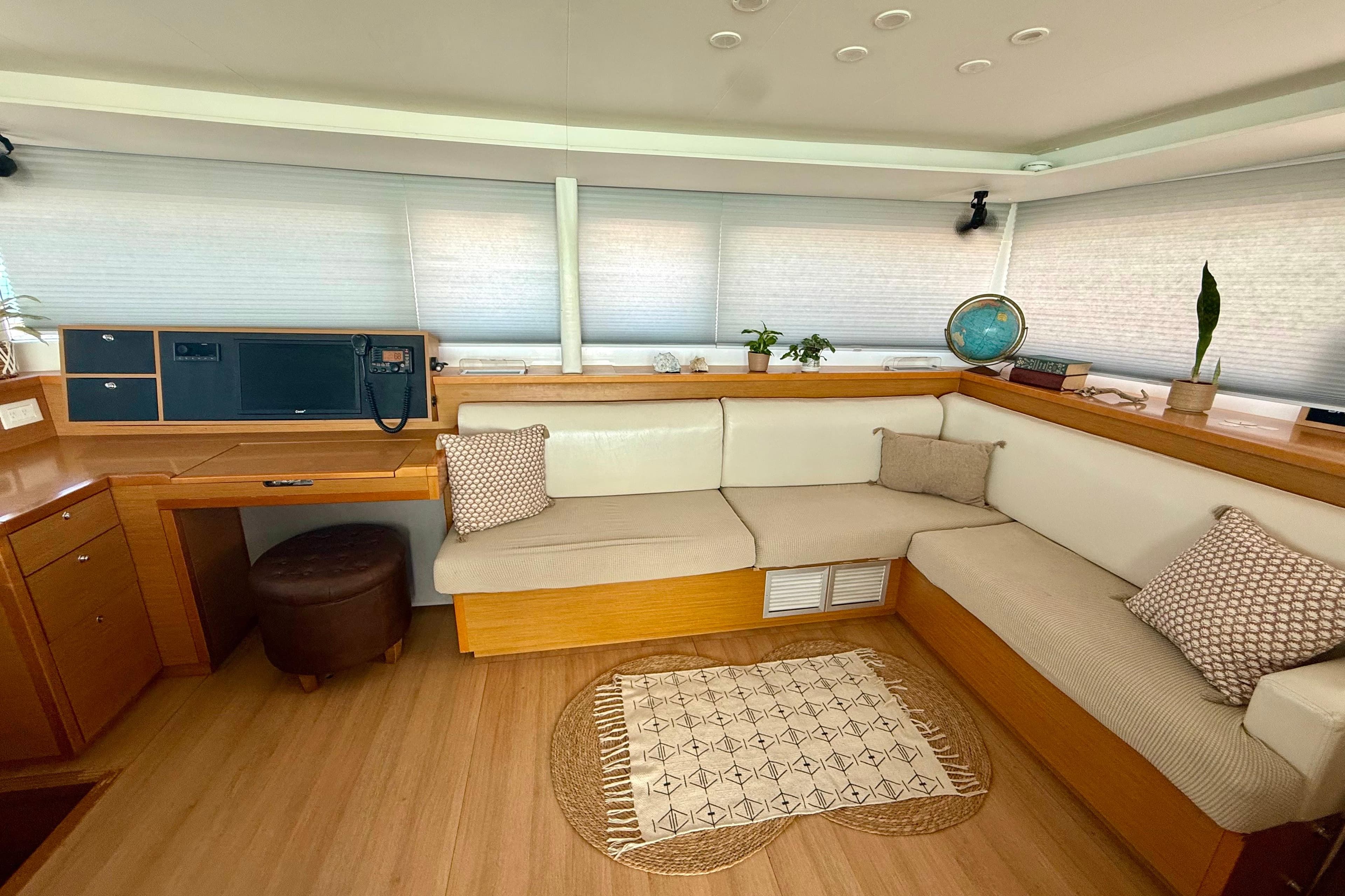 Luxurious interior of 2016 Lagoon 450 F yacht with cozy seating and decor.