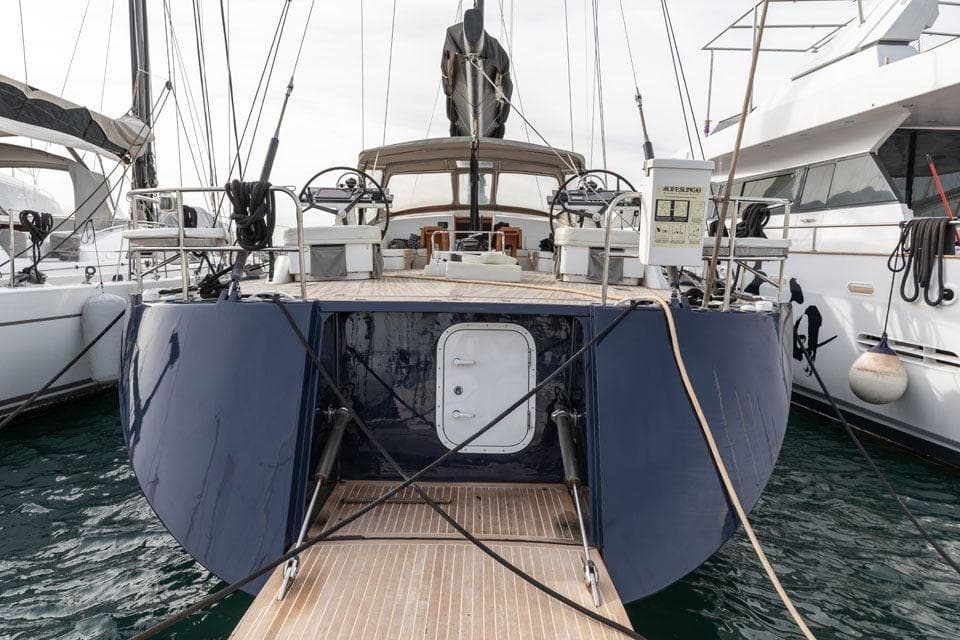 Sleek 2012 King Marine Dixon 73 yacht docked at marina, rear view.