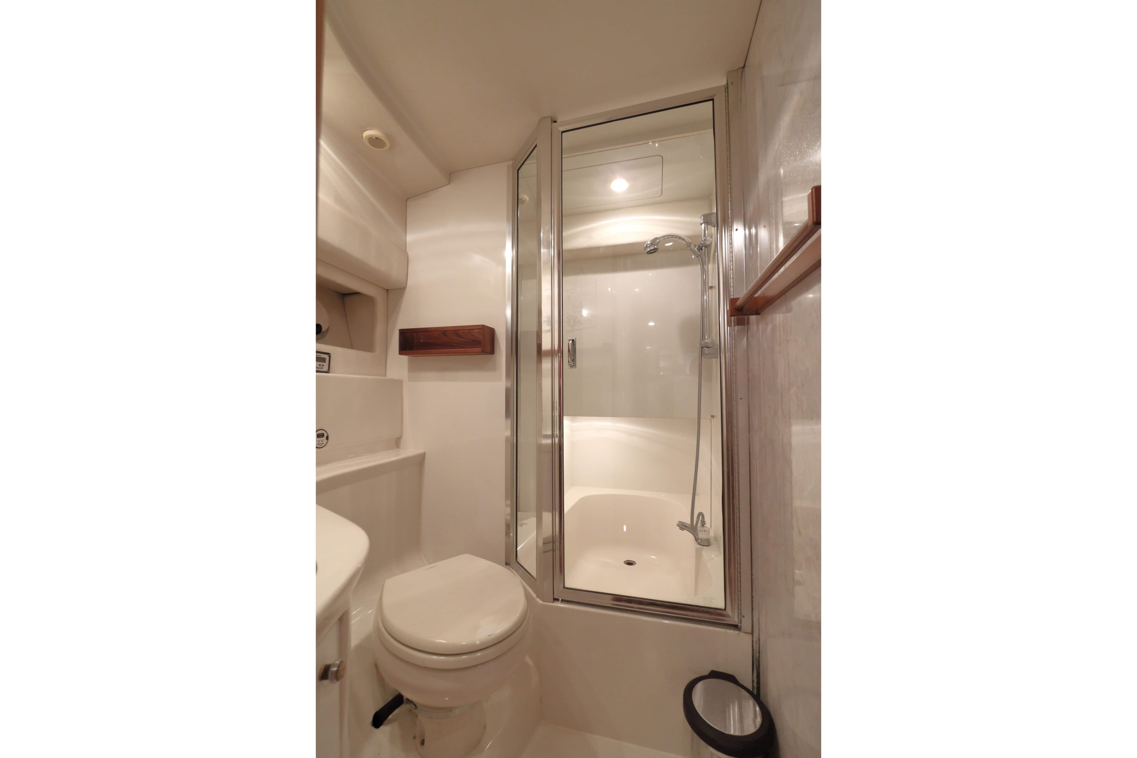 Bathroom interior of 1995 Bayliner 3988 Command Bridge Motoryacht with shower and toilet.