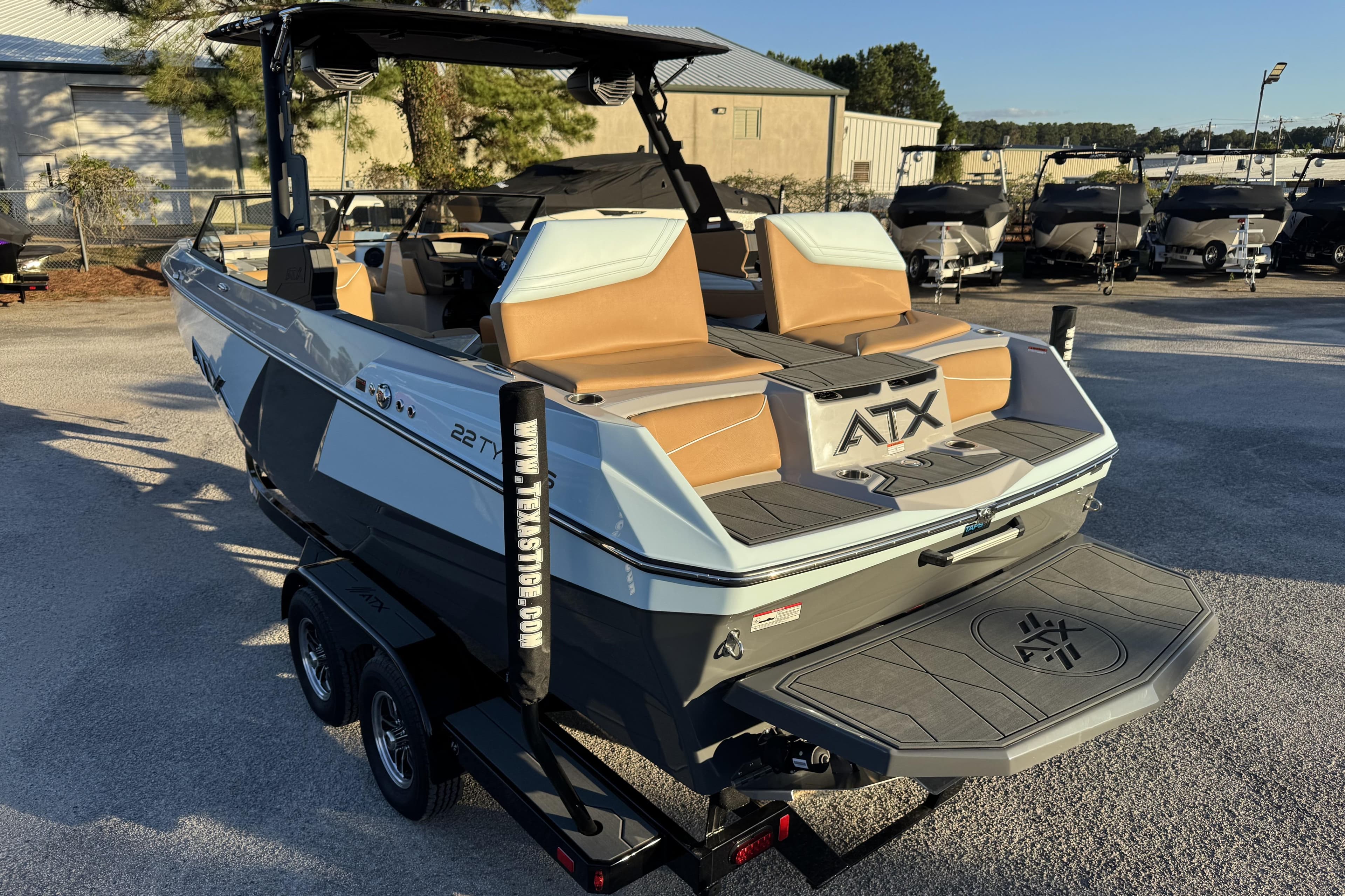 2026 ATX Surf Boats 22 Type-S on trailer, showcasing sleek design and spacious seating.