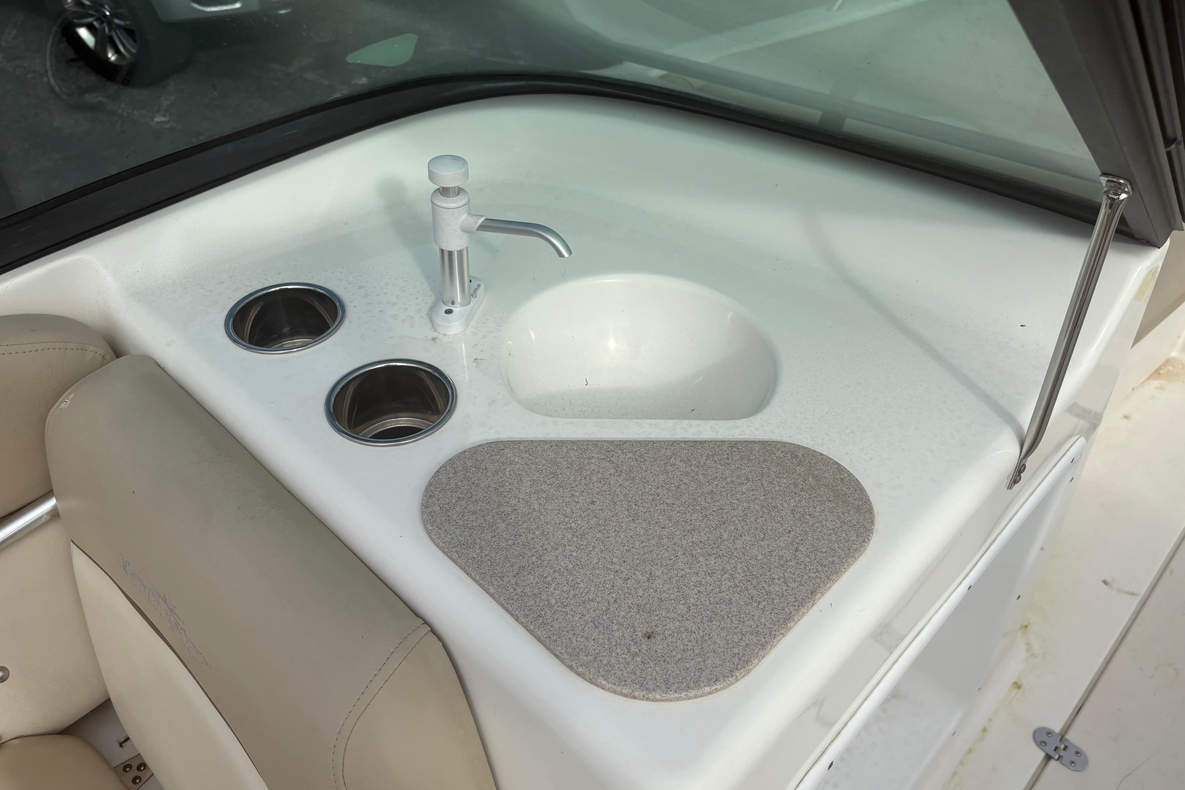 2022 NauticStar 203 DC boat interior with sink and cup holders.