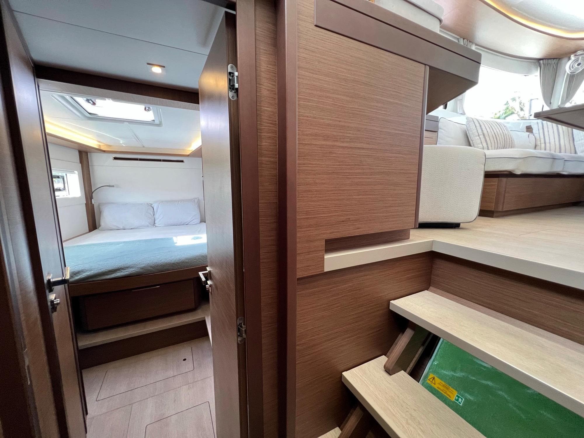 Interior of Lagoon 46 yacht, bedroom and stairs, year 2022.