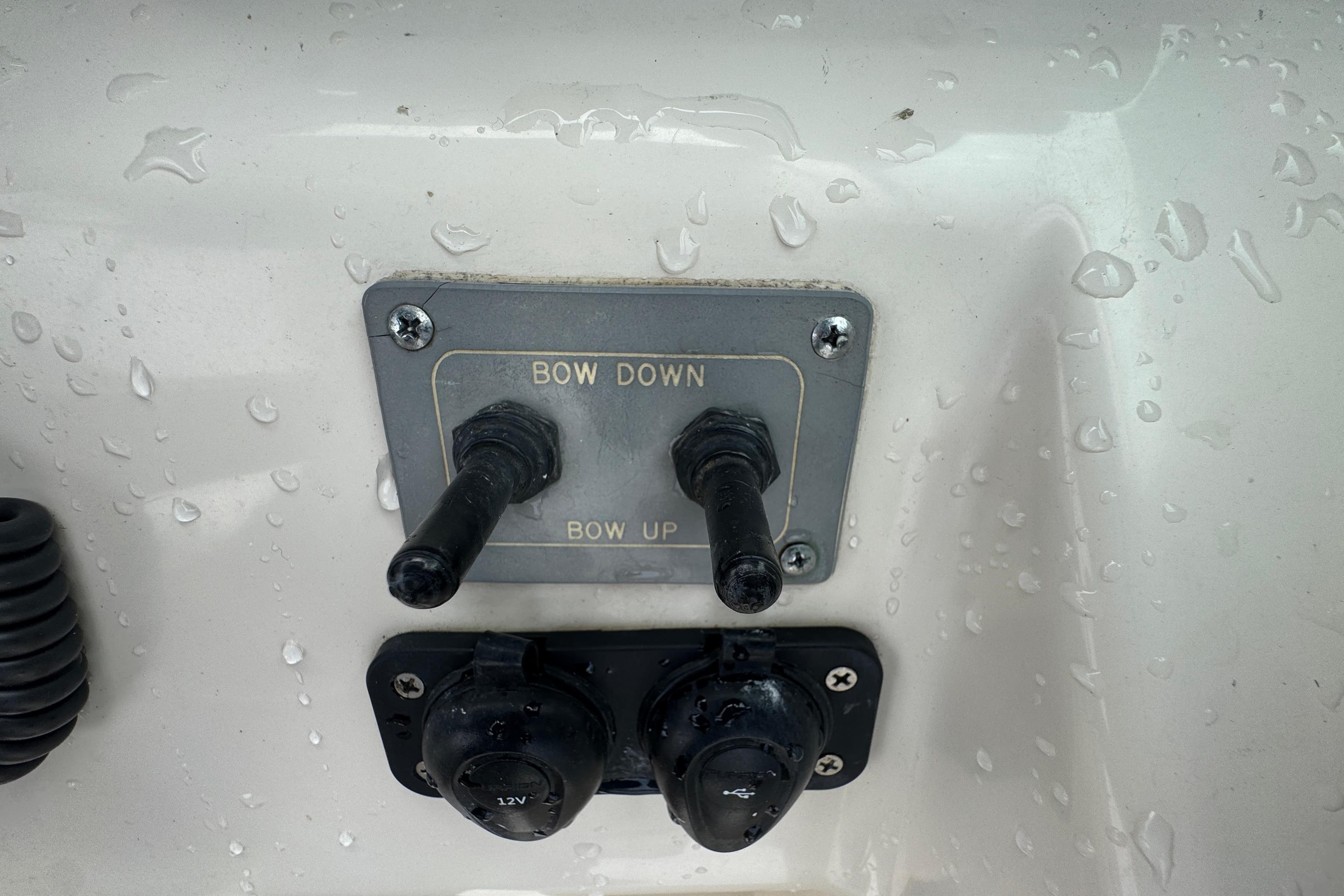 Boat control panel with "Bow Down" and "Bow Up" switches, Pursuit 2470 Walkaround, 2000 model.