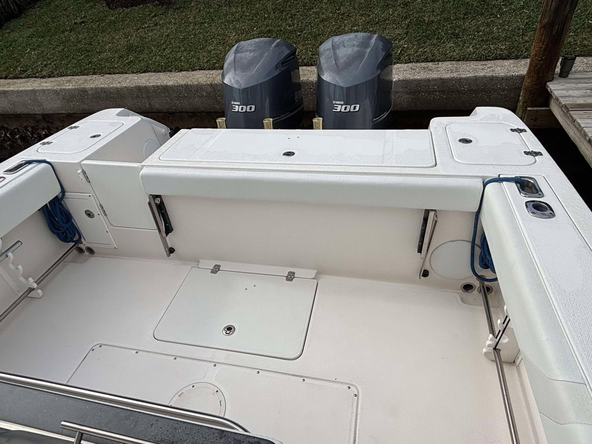 2012 Edgewater 318CC boat with dual 300 horsepower engines, spacious deck layout.