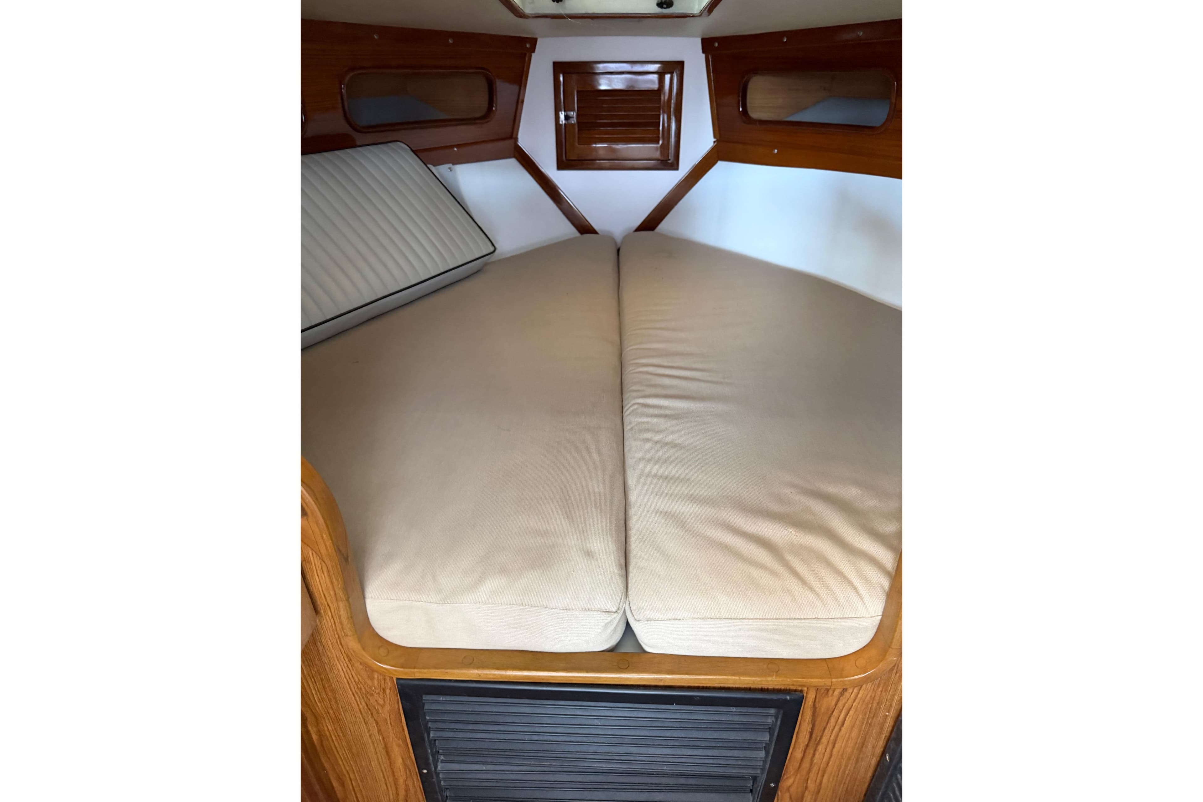 2024 Strike 29 FT Center Console cuddy cabin interior with beige cushions.
