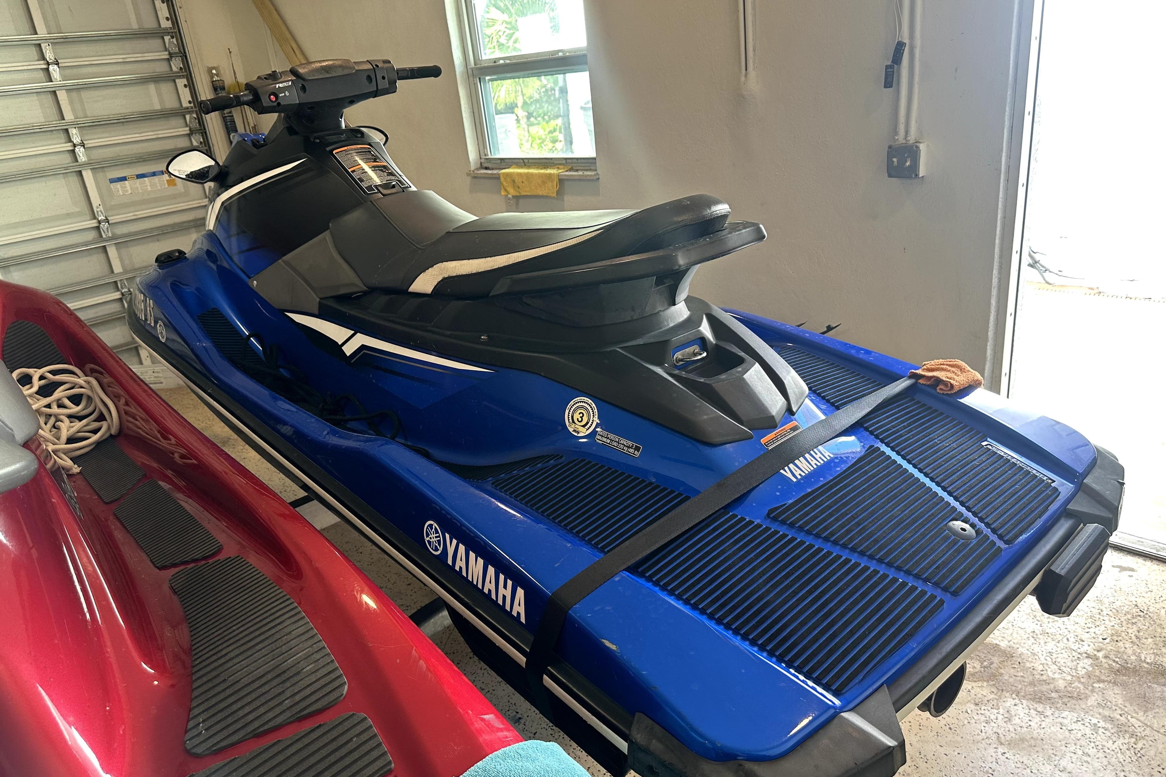 2018 Yamaha WaveRunner EX Deluxe in a garage, blue and black design.