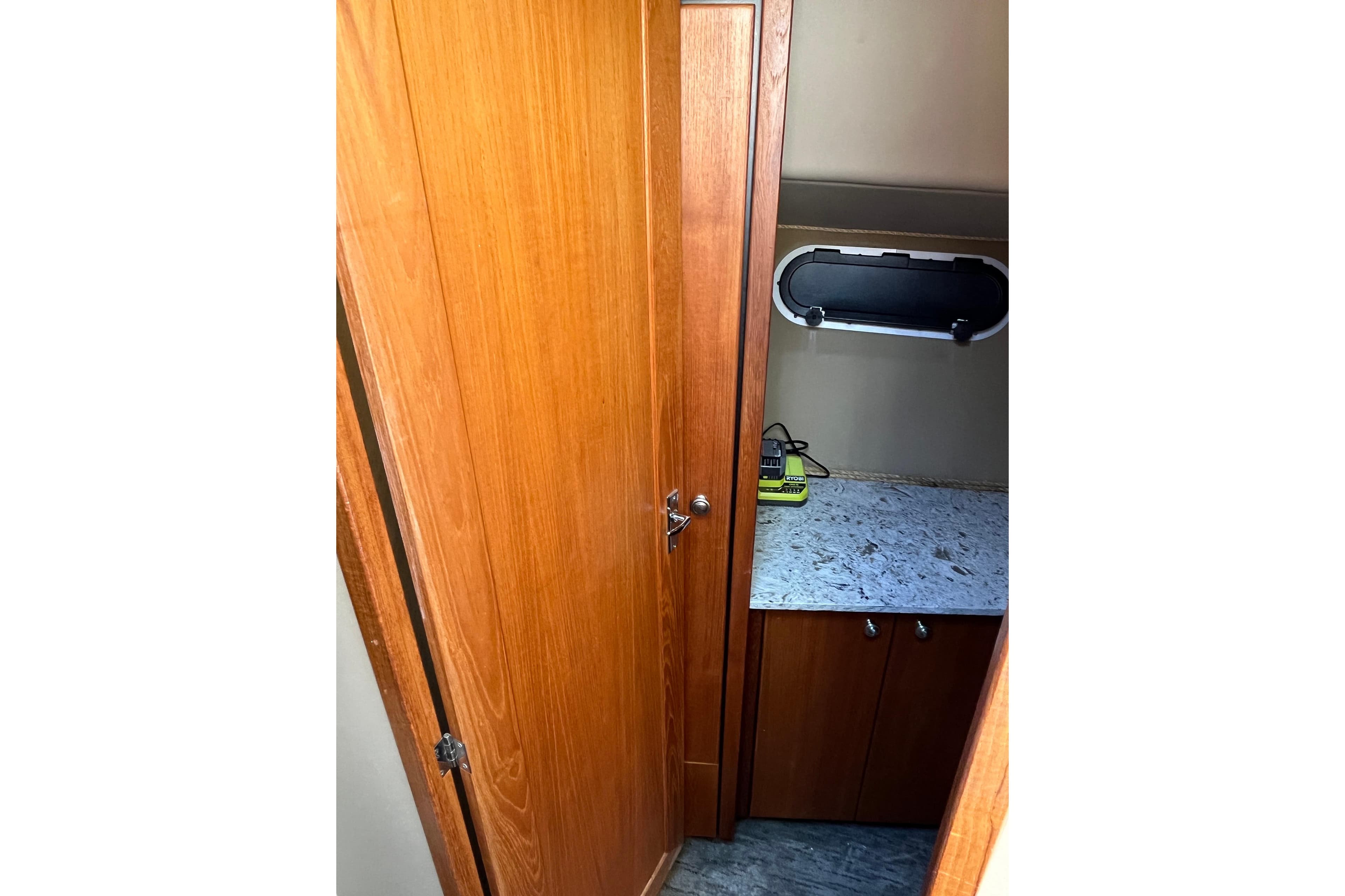 1996 Bayliner 3788 Command Bridge Motoryacht interior with wooden cabinetry and countertop.