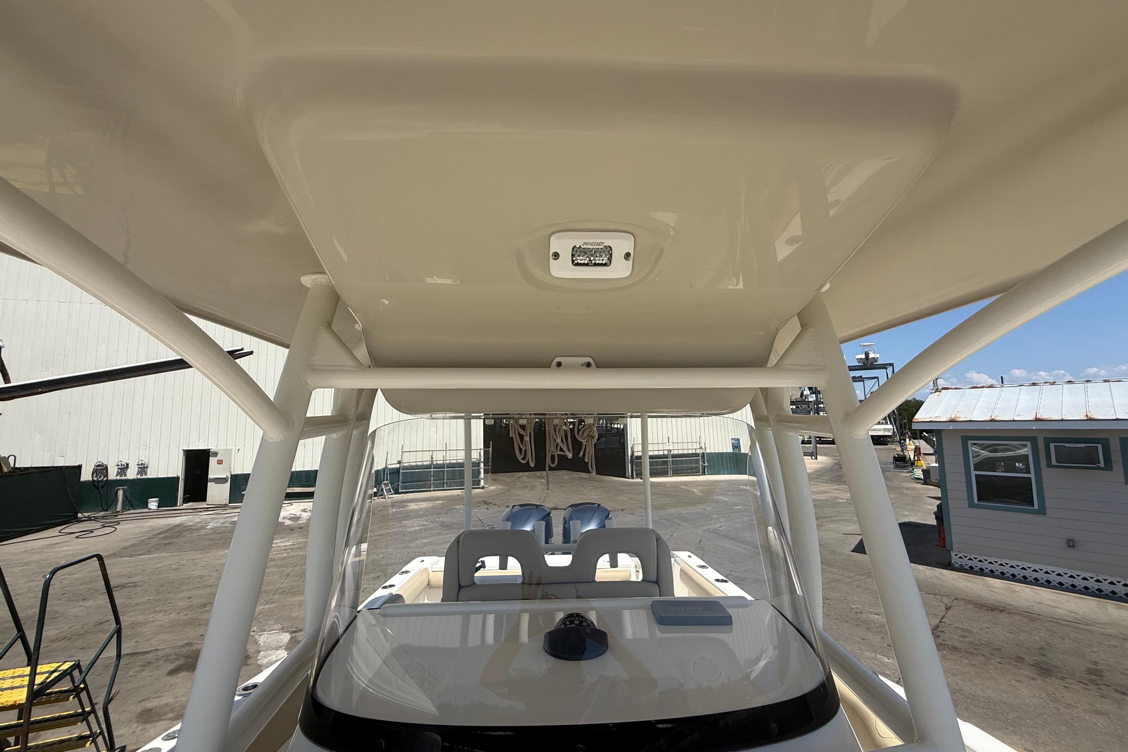 2019 Key West Billistic 281 Center Console boat interior, showcasing helm and T-top structure.