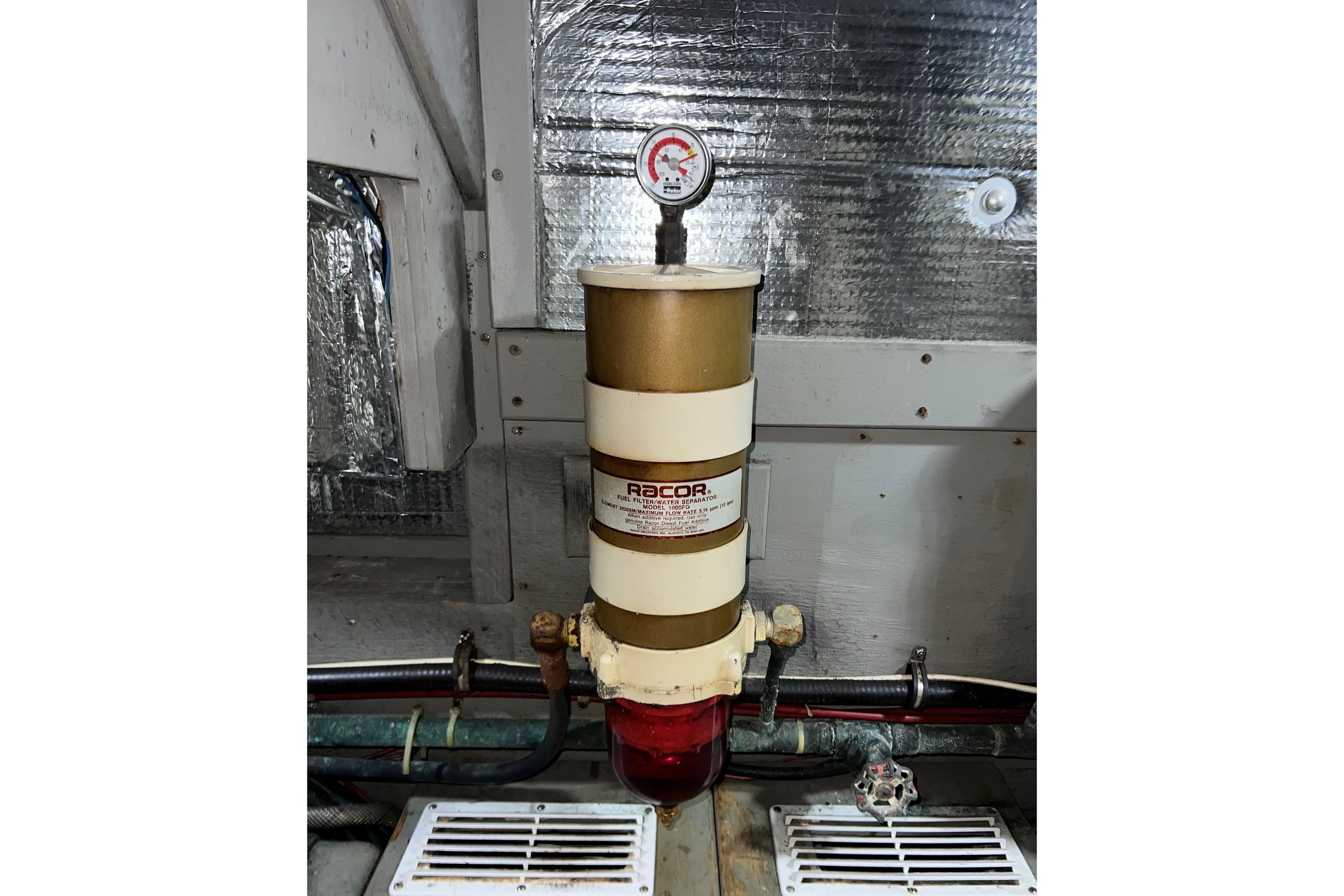 Fuel filter system in 1985 Tollycraft 48 Cockpit Motor Yacht engine room.