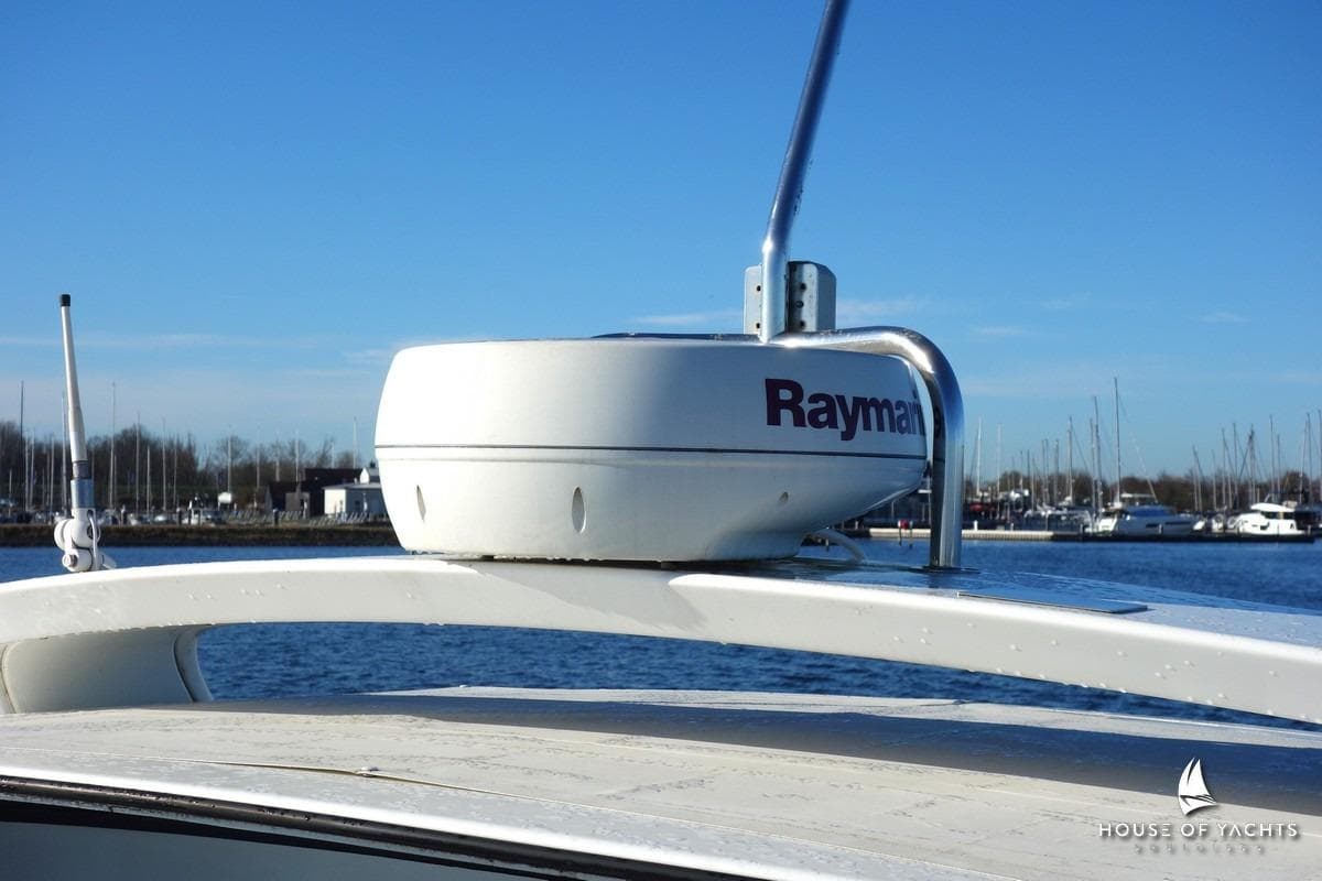 Radar system on 2005 Beneteau Flyer 12 yacht, docked in a marina.