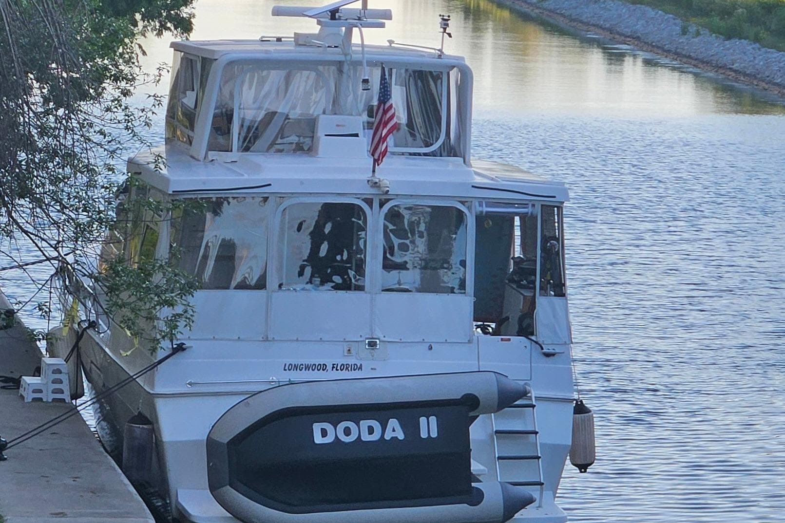 1998 Mainship 47 Motor Yacht docked in Longwood, Florida, with American flag.