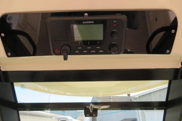 Garmin marine radio on 2025 Chris-Craft Catalina 28 dashboard.