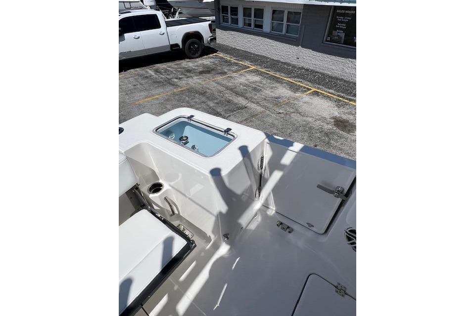 2026 Robalo R300 Center Console boat interior with seating and storage compartments.