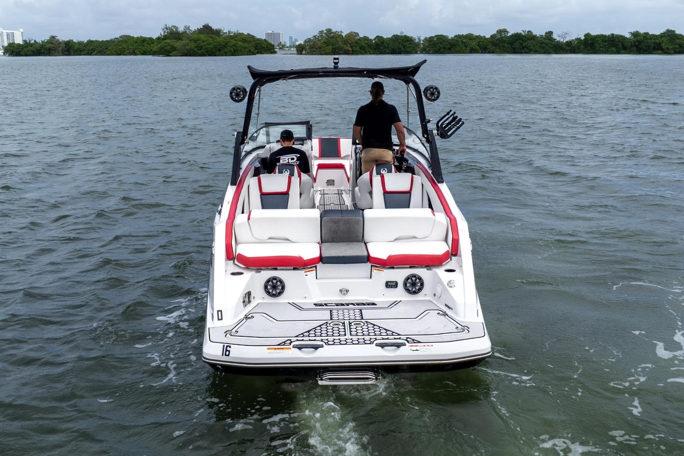 2017 Scarab 255 H.O. Impulse boat cruising on a calm lake.