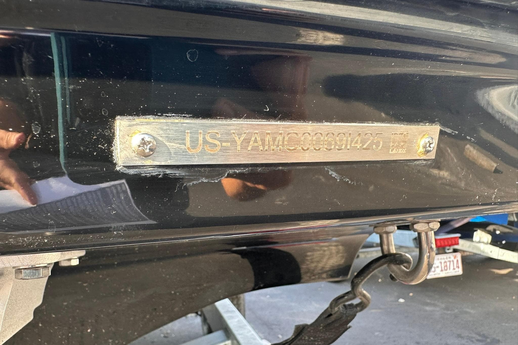 2025 Yamaha Boats AR190 hull identification number plate on a black surface.