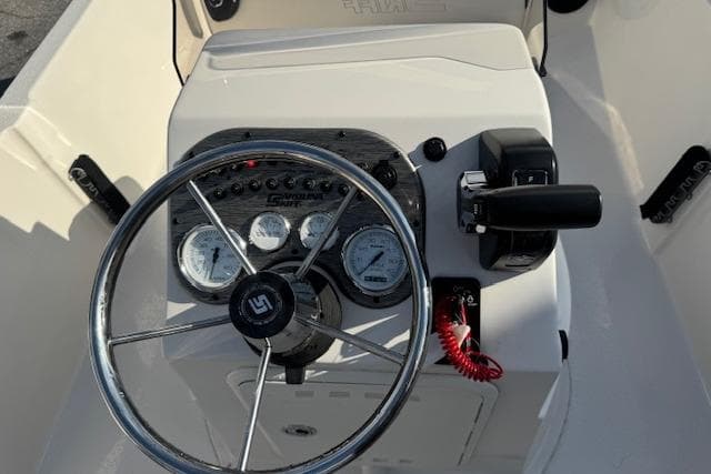 Steering console of 2026 Carolina Skiff 192 JLS boat with gauges and controls.