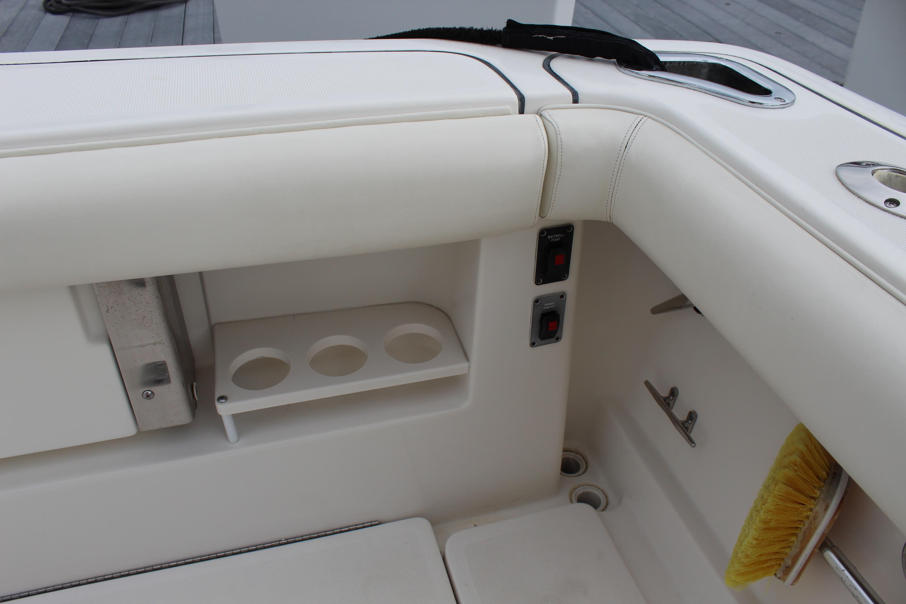 2002 Tiara Yachts 3800 Open boat interior with cup holders and storage compartments.