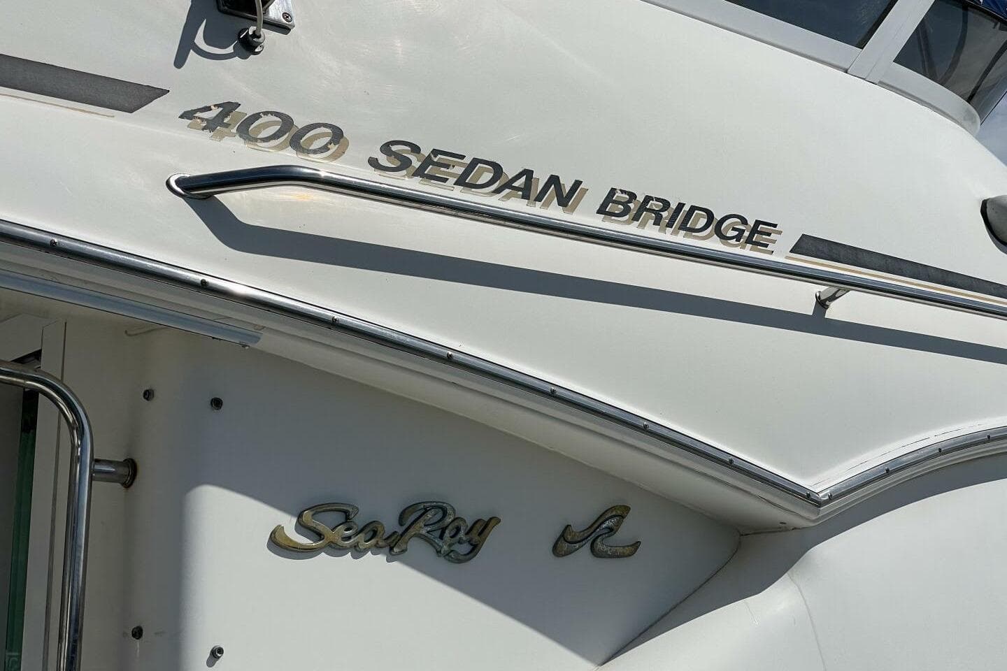 Sea Ray 400 Sedan Bridge 2000 model boat exterior with logo and nameplate.