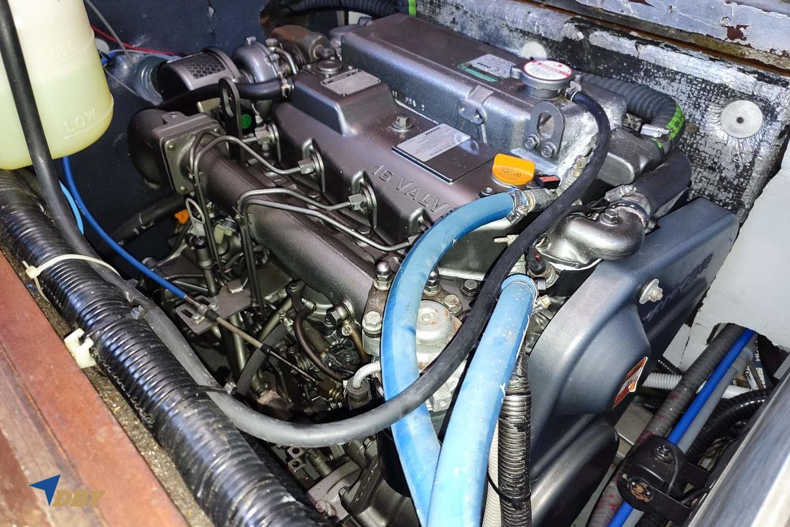 Engine compartment of a 2006 Dudley Dix 43 sailboat, showcasing detailed mechanical components.